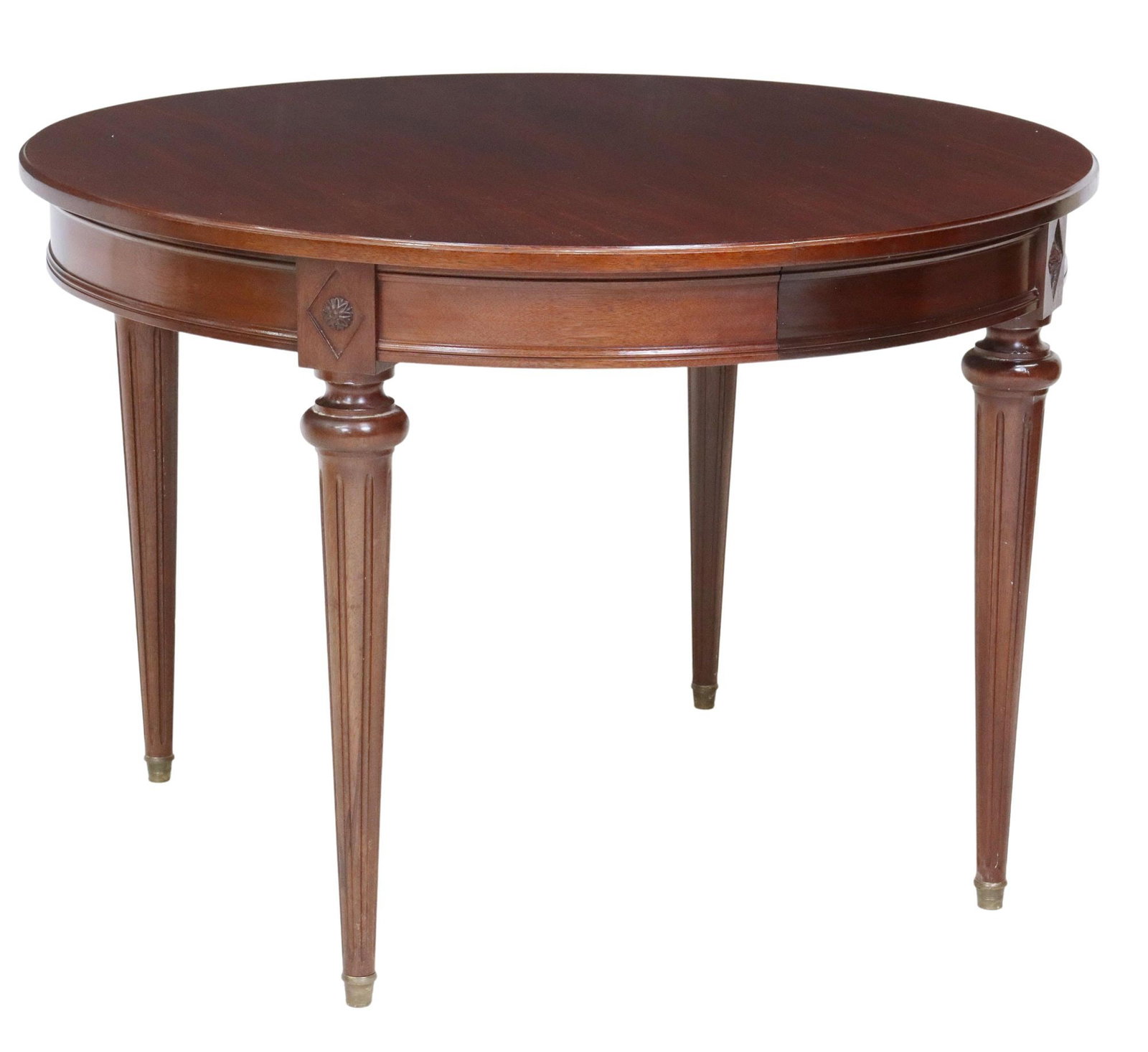 FRENCH LOUIS XVI STYLE CIRCULAR TOP DINING TABLE: French Louis XVI style circular top mahogany extension table, 20th c., rising on tapered ribbed supports with brass capped feet, lacking leaves, approx. 30.5"h, 43" diam. Start Price: $150.0