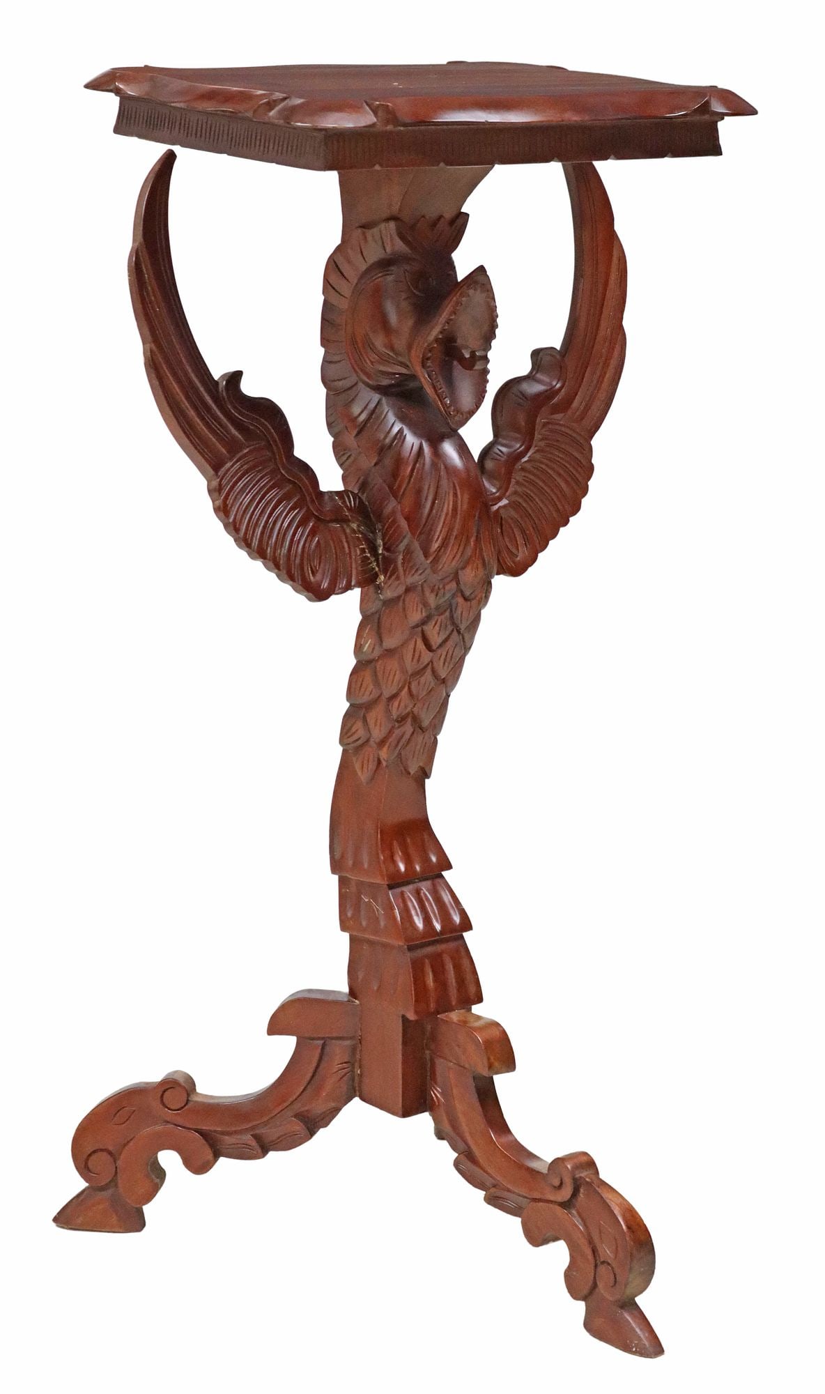 CARVED MAHOGANY FIGURAL WINGED GROTESQUE PEDESTAL STAND: Carved mahogany pedestal/ plant stand, 20th c., having shaped top, over figural standard modeled as a winged grotesque, rising on scrolled tripartite base, restoration to one wing, approx 36"h, 2