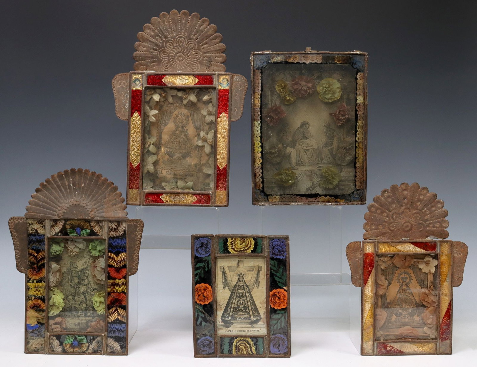 (5) FRAMED RELIGIOUS RETABLO PRINTS, MEXICO: (lot of 5) Framed retablo prints, Mexico, each housed in an embossed metal nicho/ frame, all with glass border, including: (2) Nuestra Senora de la Soledad de Santa Cruz, hairlines to border; (2)