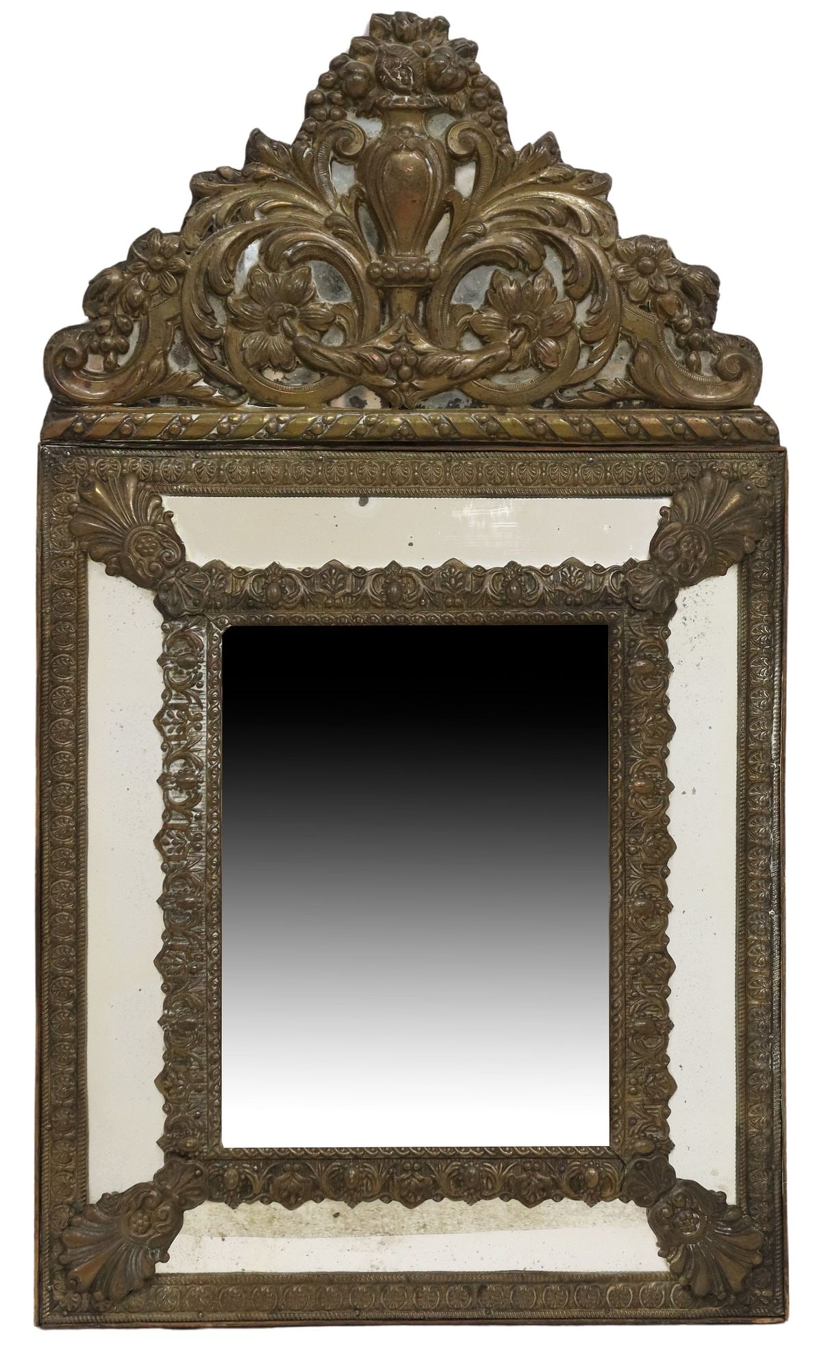 BAROQUE STYLE REPOUSSE GILT METAL MIRROR: Baroque style repousse gilt metal mirror, having scrolled foliate crest with central vase motif, over molded cushion frame, encasing central beveled mirror plate, approx 23.25"h, 13.25"