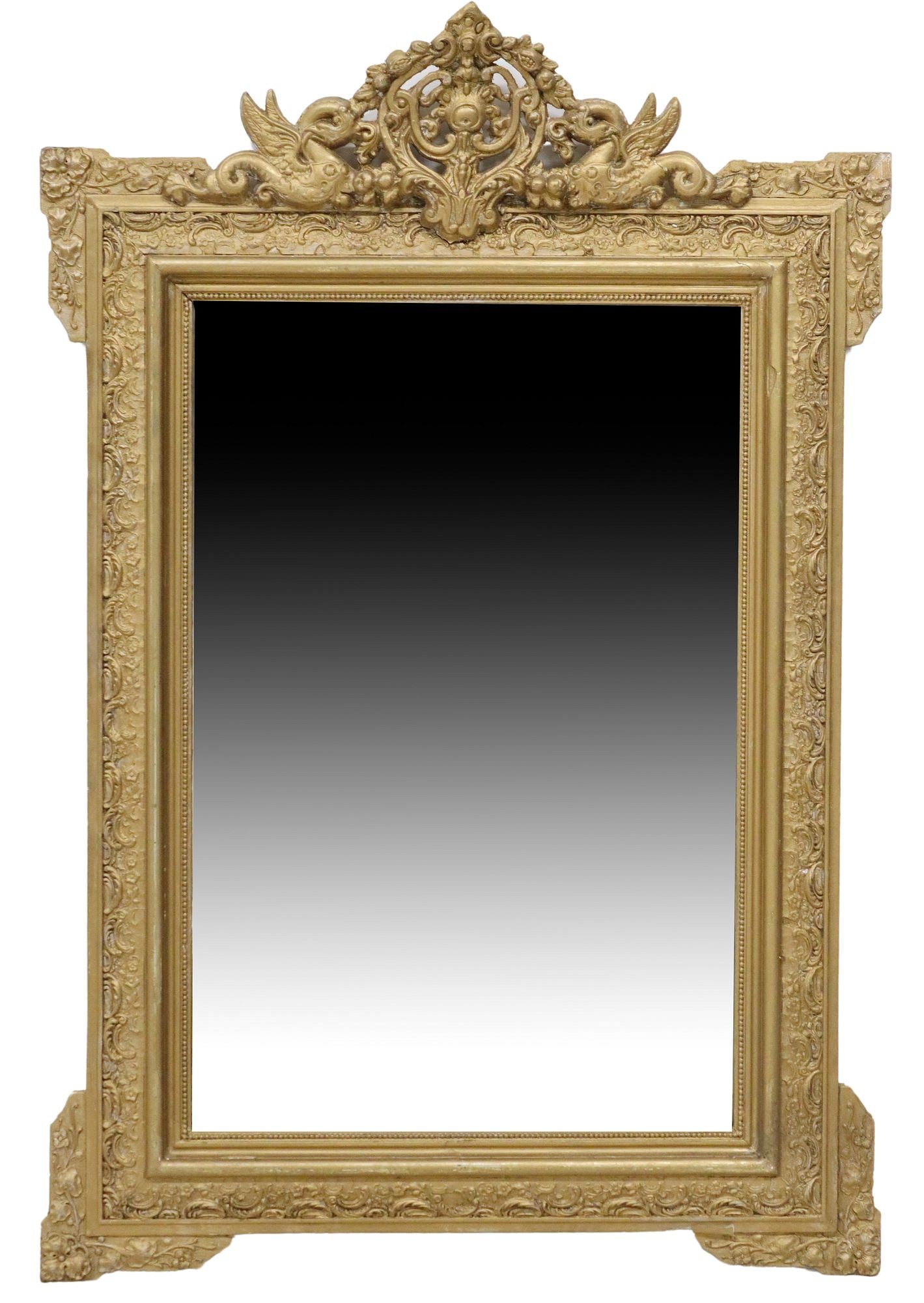 FRENCH LOUIS XVI STYLE GILT PAINTED BEVELED MIRROR: French Louis XVI style gilt painted wood and gesso wall mirror, late 19th c., pierced crest with winged grotesques and foliate motifs, over molded frame, encasing later beveled mirror plate, some