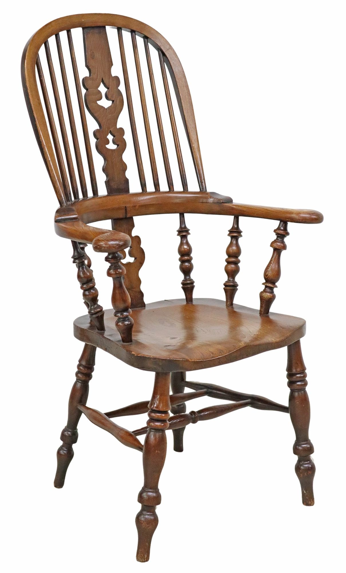 WINDSOR HIGHBACK SPINDLED ARMCHAIR: Windsor highback armchair, likely English, carved back splat, turned spindled lower back, scrolled arms, over a contoured seat, rising on stretcher-joined supports, approx 45.5"h, 25 5/8"w, 