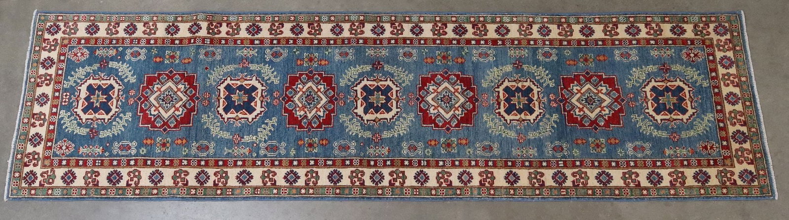 HAND-TIED ESTATE RUNNER, 9'7" X 2'7": Hand-tied estate runner, approx 9'7"l, 2'7"w **Please Note: All of the rugs offered in this auction would likely benefit from a professional cleaning. Estate rugs may show some 