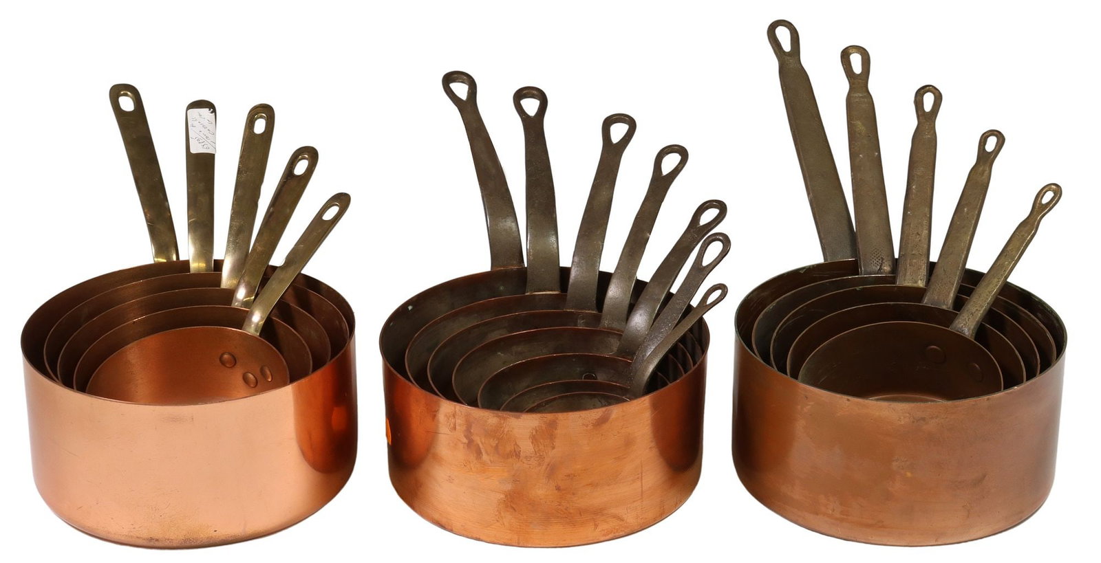 (17) FRENCH COPPER GRADUATED SAUCEPANS: (lot of 17) French graduated copper saucepans, three assembled sets, including: (7) with iron handle, largest: approx 7"h, 15"w, 8"d, smallest: approx 3.5"h, 6.5"w, 3.25"