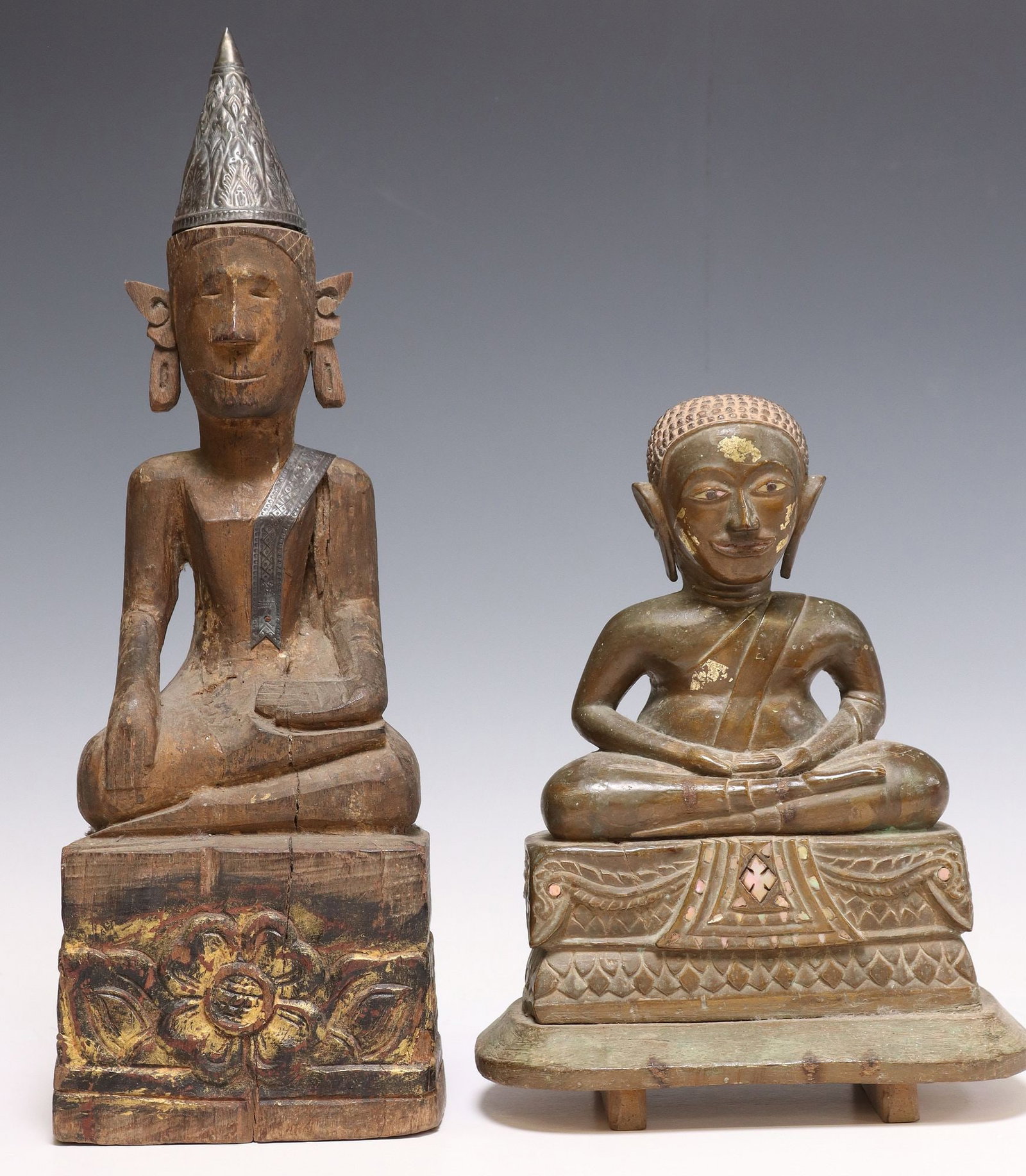 (2) SOUTHEAST ASIAN CARVED WOOD SEATED BUDDHA FIGURES: (lot of 2) Southeast Asian carved wood figures, each depicting the seated Buddha, with remnants of gilt decoration, rising on integral platform base, including: (1) in the Dhyana (meditation) Mudra, w