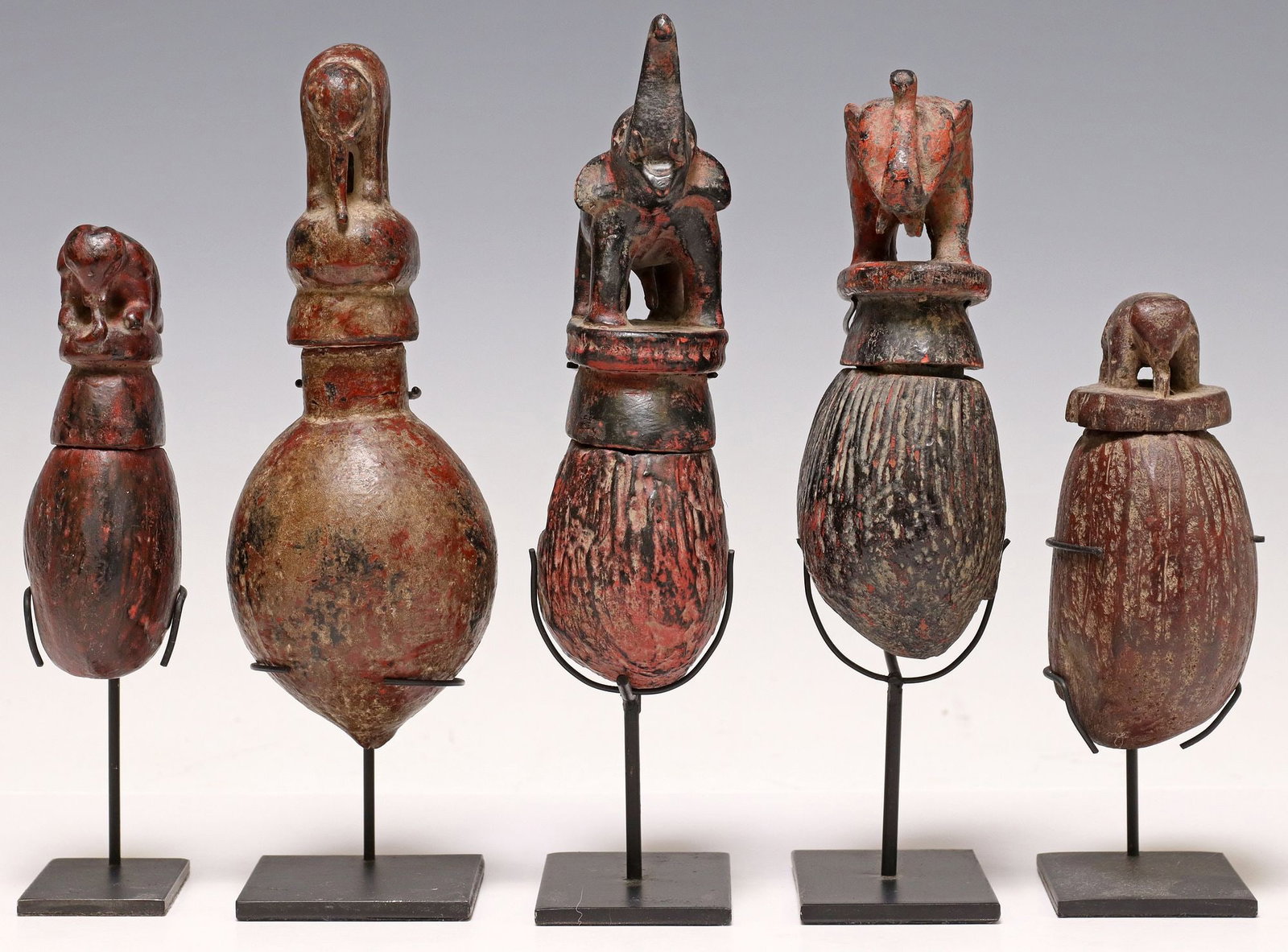 (5) CARVED & PAINTED SEED POD BOXES ON DISPLAY STANDS: (lot of 5) Carved and polychrome painted seed pod boxes, possibly Southeast Asia, varied designs, each having lid modeled as an elephant, accompanied by metal display stand, largest: approx 8.75"
