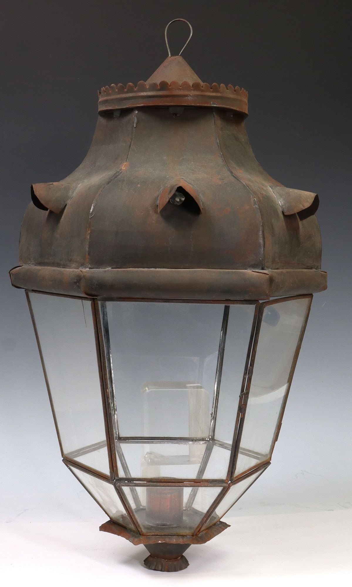 PATINATED TOLE IRON & GLASS 1-LT LANTERN: Patinated tole iron and glass single-light lantern, early 20th c., hexagonal frame with inset colorless glass panels, small break to door panel glass at corner, in need of wiring, approx 22"h, 13