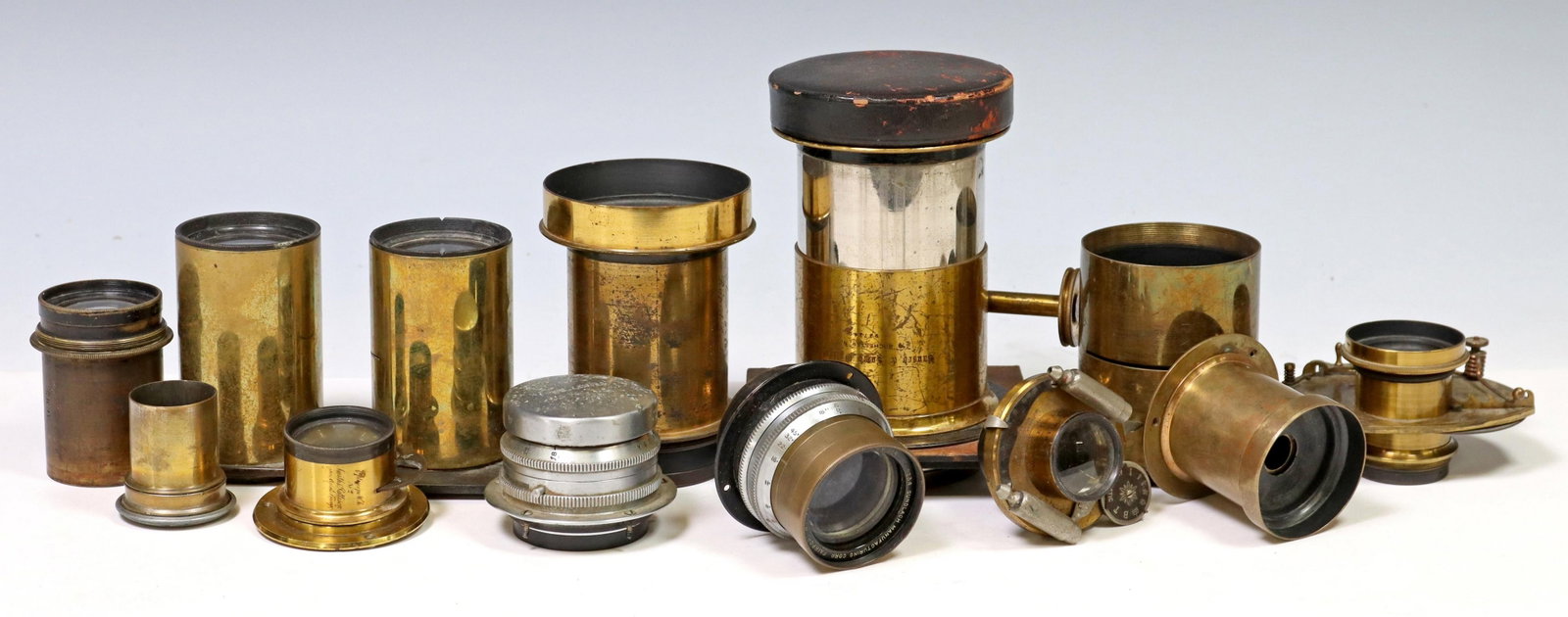 (13) VINTAGE CAMERA LENS: (lot of 13) Vintage camera lens: (1) Bausch & Lomb Optical, rack and pinion, 4.25" x 4.25" lens board, approx. 5.75"l; (1) Rosch Co, NYC, Duplex; (1) R.H. Beck, W.H. Walmsley, Philadelphia, lacking in