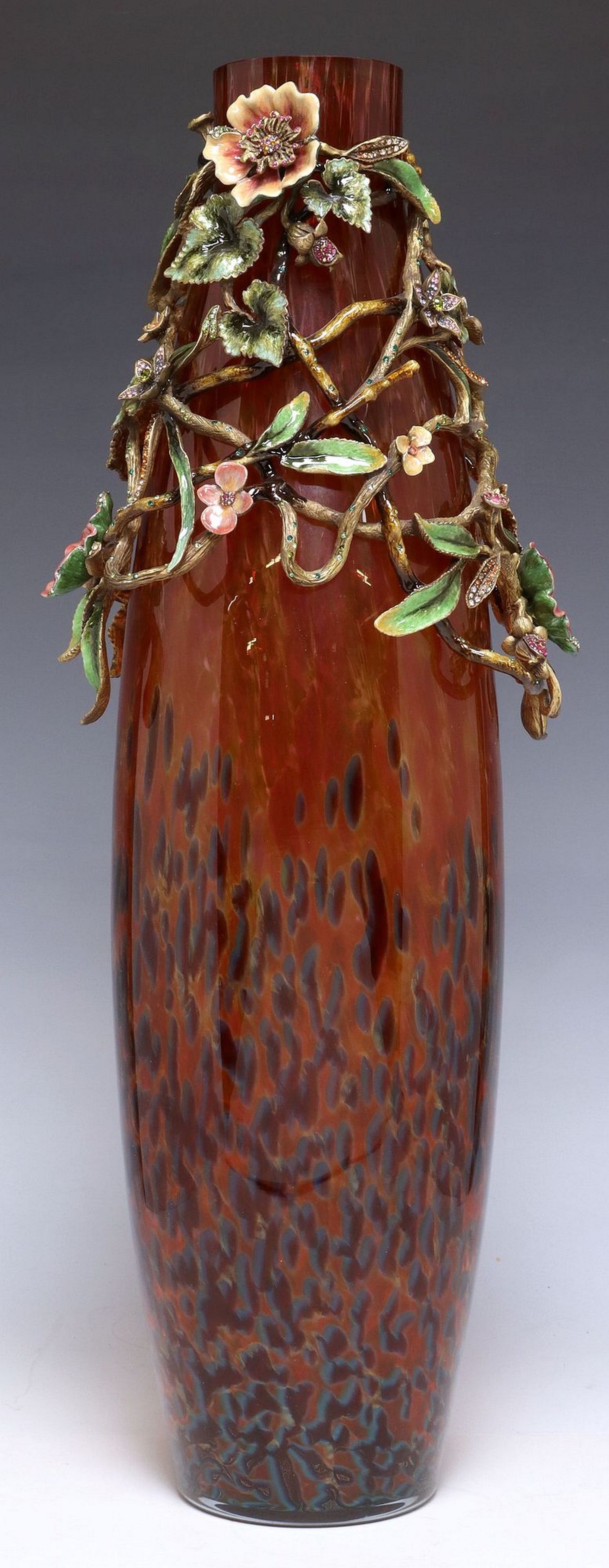 JAY STRONGWATER 'ROSALIND' ART GLASS ENAMEL BRANCH & FLOWER VASE, 21": Jay Strongwater "Rosalind" art glass vase, mottled orange to blue glass vase, overlaid with a polychrome enameled metal collar modeled as flowering branches, embellished with Swarovski 