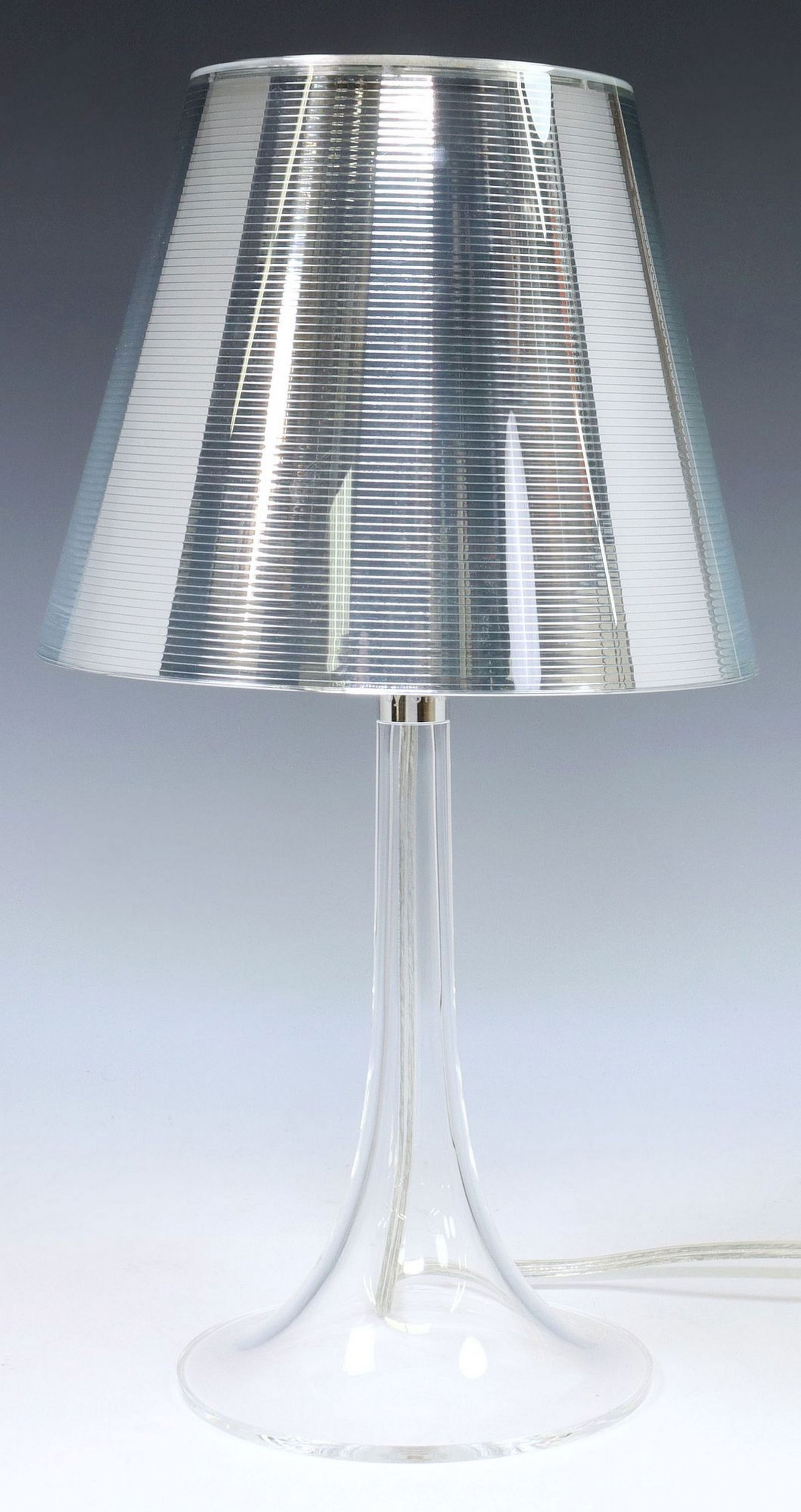 PHILIPPE STARCK (B.1949) FOR FLOS 'MISS K' TABLE LAMP: Modern "Miss K" table lamp, Philippe Starck (French, b.1949) for FLOS, 21st c., with silver-tone diffuser, approx 17"h, 9.25"diam, 2.75lbs