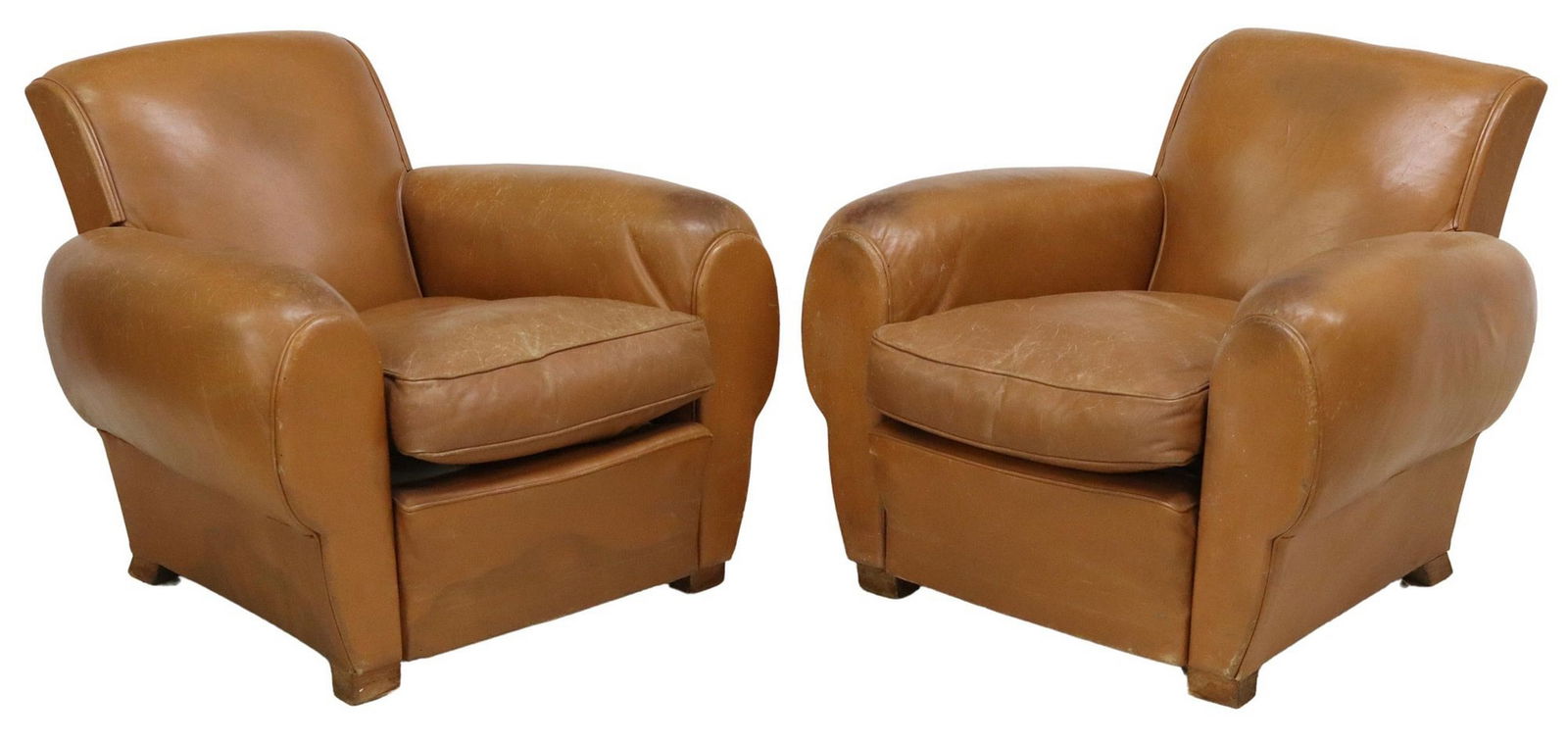 (2) FRENCH ART DECO STYLE LEATHER CLUB CHAIRS: (pair) French Art Deco style leather club chairs, 20th c., having shaped back, over rolled arms, rising on squared wood supports, picks, creasing/ cracking to leather, approx 30.5"h, 36"w, 3