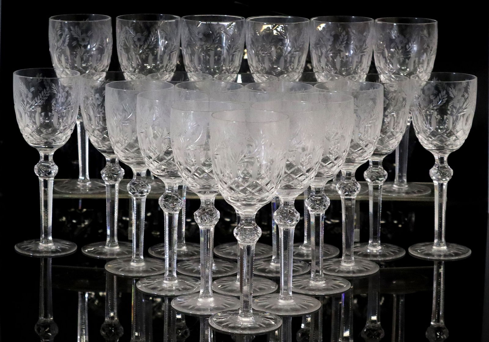 (23) CRYSTAL CLEAR INDUSTRIES 'CELINE' WINE GLASSES: (lot of 23) Clear Crystal Industries cut crystal wine glasses, in the "Celine" pattern, floral trim over vertical cuts and crisscross pattern, knopped stem, on round foot, approx 7 7/8"