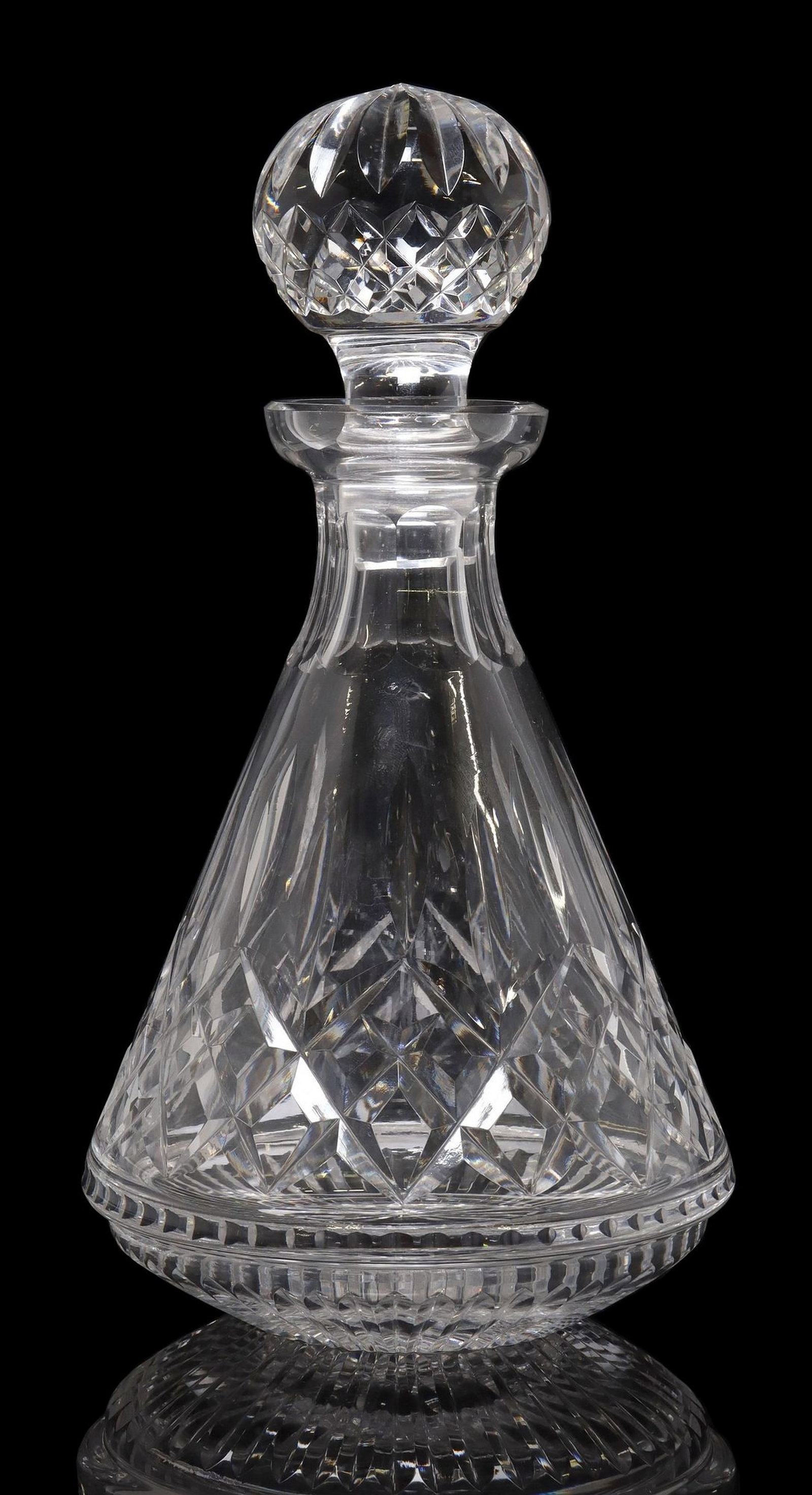 WATERFORD 'LISMORE' CRYSTAL ROLY POLY DECANTER & STOPPER: Waterford crystal roly poly decanter, in the "Lismore" pattern, having stopper with convex cuts encircling finial, flared mouth over fluted neck, the body with vertical cuts and crisscr