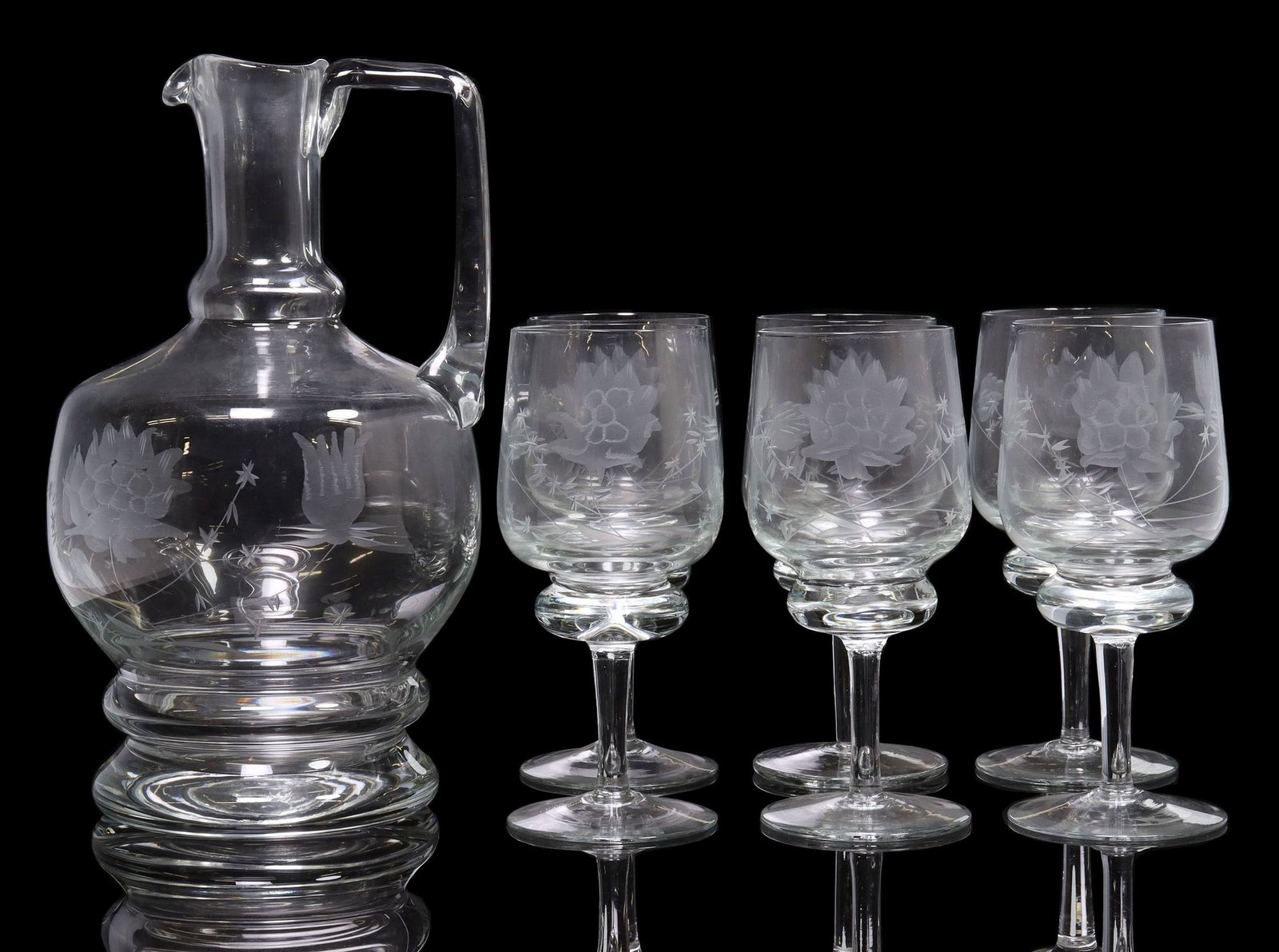 (7) ETCHED HAND-BLOWN WINE GLASSES & DECANTER: (lot of 7) Blown glass stemware and pitcher, apparently unmarked, etched with Japanese style lotus flowers and stylized bamboo, including: (1) decanter, angular handle extending from one side, raised 