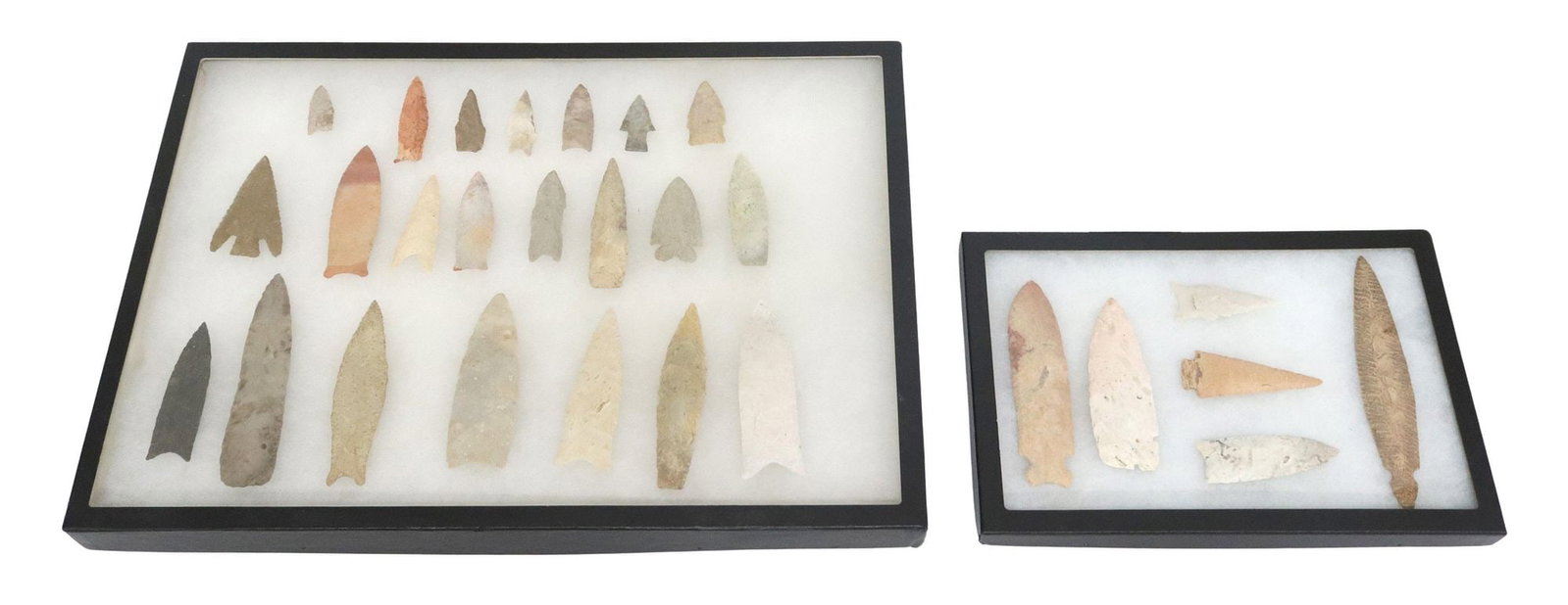 (28) STONE ARROWHEADS, SPEAR POINTS: (lot of 28) Stone arrowheads and spearpoints, largest item 6.7/8"l, 1.25"w, all housed in two Riker boxes, larges box approx. 1" x 14.24" x 20.25", total of both 5.50lbs