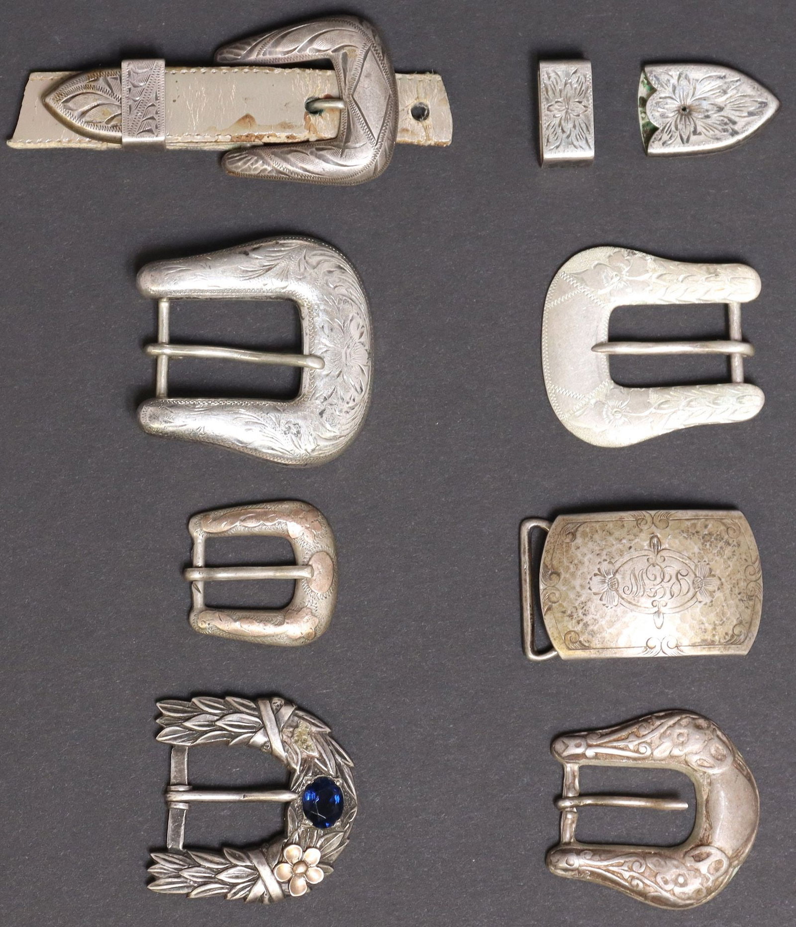 (LOT) WESTERN STERLING SILVER RANGER & OTHER BELT BUCKLES: (lot) Sterling silver ranger and other belt buckles, highlights include: (3 piece) ranger buckle set, Western Silversmiths, Canoga Park, California, (one) buckle, (one) keeper, (one) tip, (3 piec