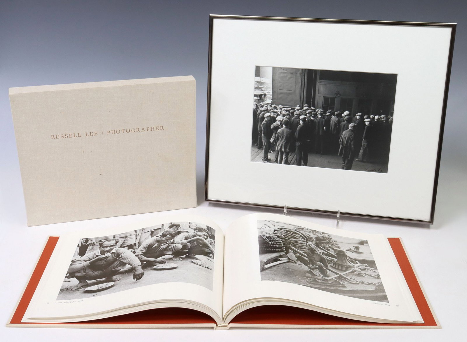 (2) RUSSELL LEE (1903-1986) SIGNED GREAT DEPRESSION SUBJECT PHOTOGRAPH & MONOGRAPH: (lot of 2) Framed photographic print, "Unemployed, Winter of 1935-36, New York City," signed lower right Russell Lee (American, 1903-1986), label verso for Garner & Smith Gallery, Austin