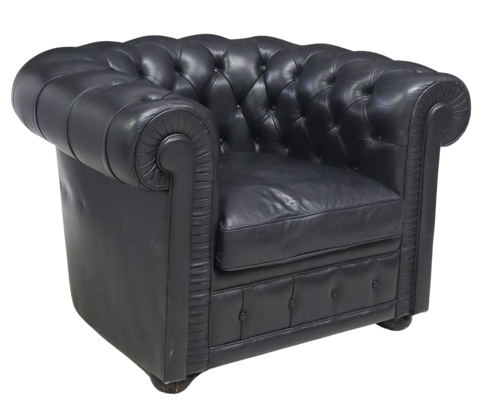 BUTTON-TUFTED BLACK LEATHER CLUB CHAIR: Club armchair, 20th c., black leather upholstery, with rolled button-tufted back and arms, removable seat cushion, rising on bun feet, approx 29"h, 41.5"w, 36"d, seat height: approx 16.