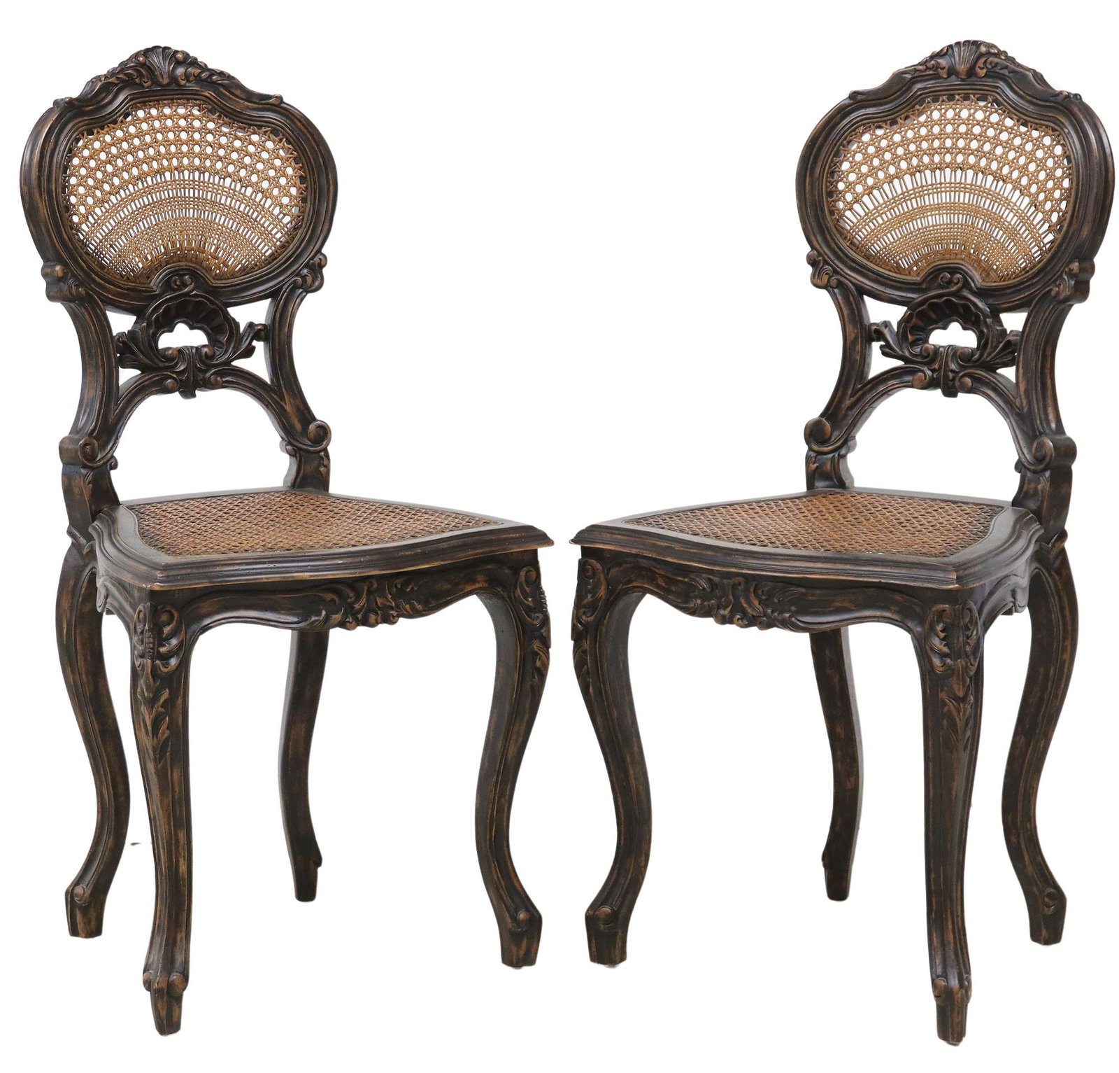(2) LOUIS XV STYLE CARVED WOOD CANED SIDE CHAIRS: (pair) Louis XV style carved wood side chairs, 20th c., each having fanned crest, over caned back and seat, rising on cabriole legs, ending on whorl feet, approx 37.5"h, 18"w, 16"d, sea