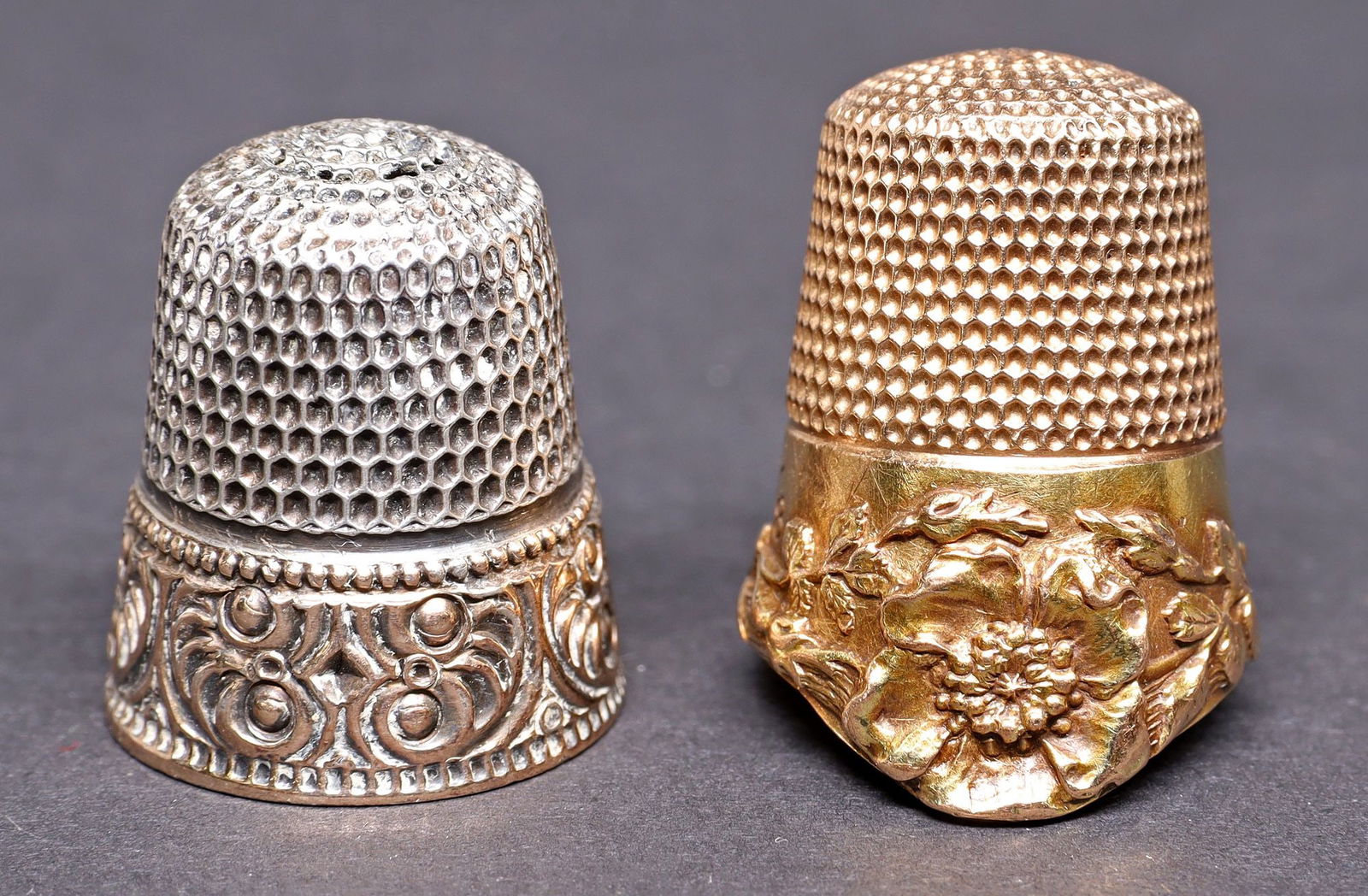 (2) VICTORIAN 14KT ROSE GOLD & SILVER SEWING THIMBLES: (lot of 2) Victorian sewing thimbles, including: (1) 14kt rose gold (tested) thimble, with poppy motif, marked size 8, illegible stamped mark at interior top, engraved Dorothy Dann, small dents, 4.7 g