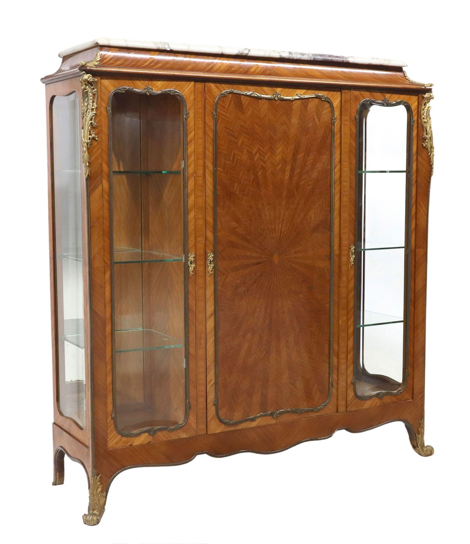 FINE FRENCH LOUIS XV STYLE ORMOLU-MOUNTED VITRINE CABINET: French Louis XV style marble-top display cabinet or bookcase, early 20th c., cavetto frieze, bronze dore case mounts, center cabinet door with radiating chevron matched veneers, flanked by side c