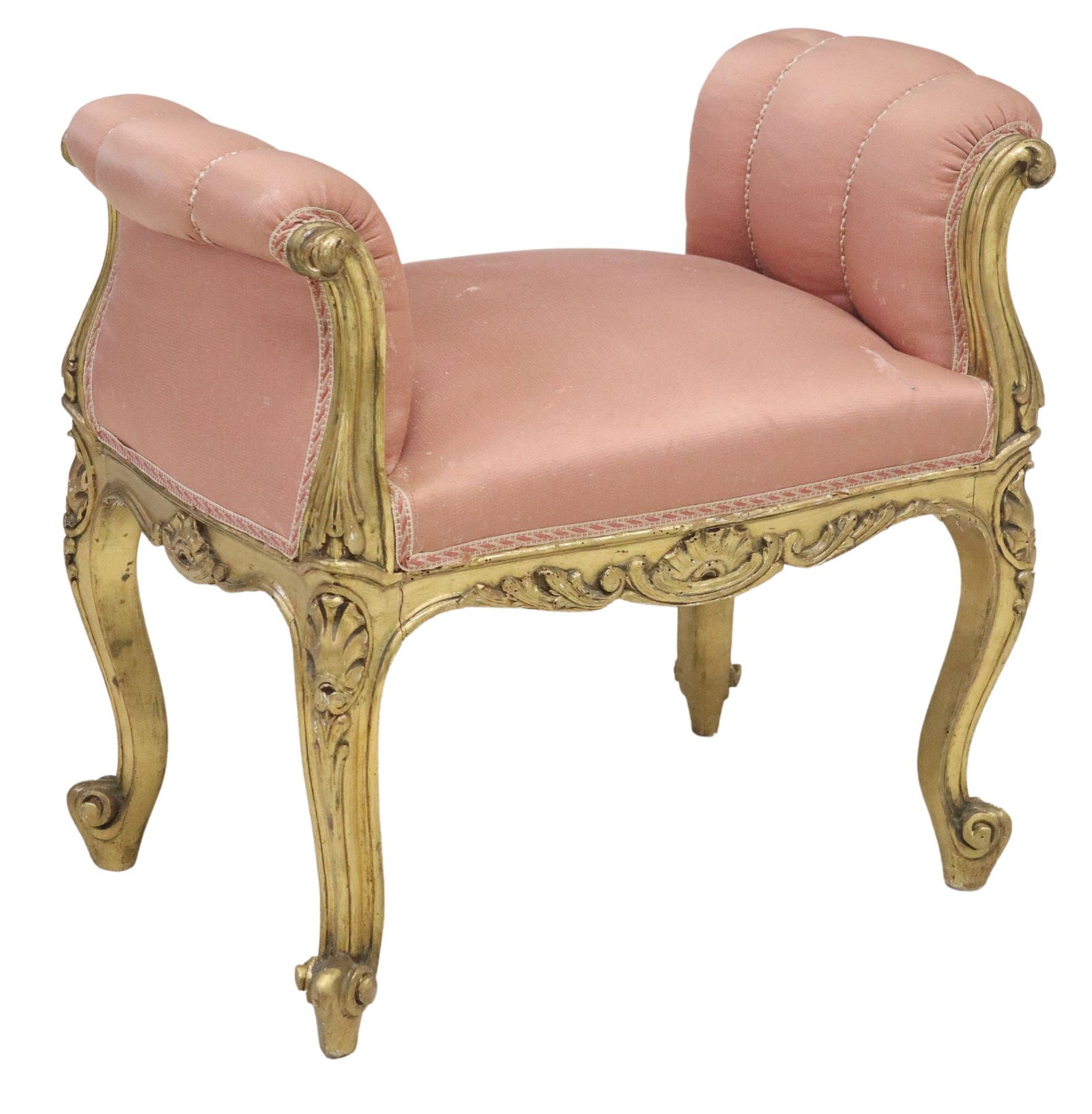 LOUIS XV STYLE GILTWOOD UPHOLSTERED BENCH: Louis XV style giltwood bench, 20th c., having light pink upholstery, with scrolled arms, ending on whorl feet, approx 23"h, 26 5/8"w, 16.25"d