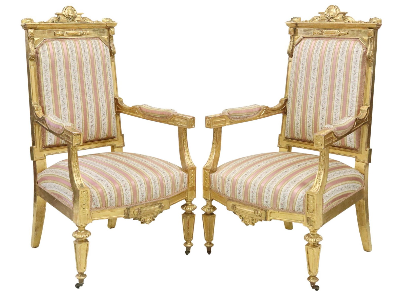 (2) LOUIS XVI STYLE GILTWOOD UPHOLSTERED FAUTEUILS: (pair) Louis XVI style giltwood armchairs, 19th c., each having fanned crest, over molded frame, in striped floral upholstery, rising on squared and tapered supports, ending on casters, approx 46
