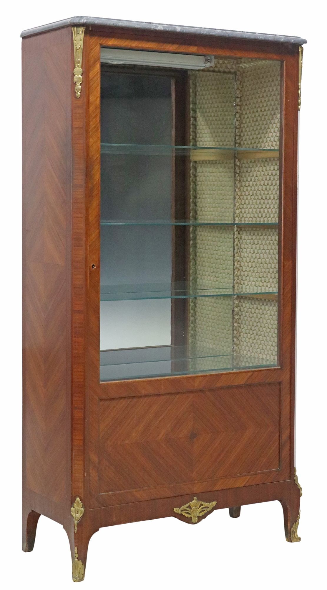 LOUIS XV STYLE MARBLE-TOP MATCHED VENEER VITRINE: Louis XV style matched veneer vitrine/ display cabinet, 20th c., having shaped marble top, over glazed cabinet door, revealing shelved interior with mirrored back and single light, rising on short cab