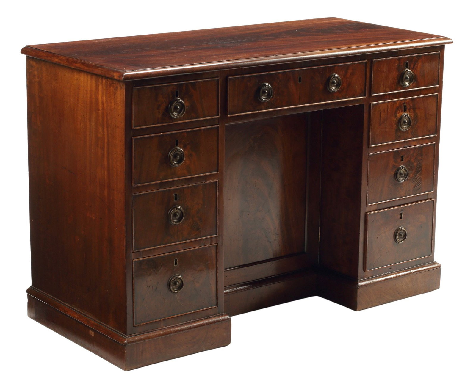 ENGLISH GEORGE IV MAHOGANY KNEEHOLE DESK: English George IV mahogany kneehole desk, central frieze drawer, kneehole with integral cabinet, flanked by four graduated short drawers, on plinth base, approx 31"h, 45"w, 21"d