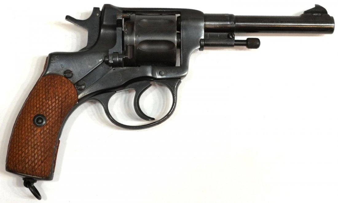 RUSSIAN WWII NAGANT DA REVOLVER, MADE 1941: Russian WWII military Model 1895 Nagant double action revolver, 7.62mm caliber, seven round cylinder, 4.5" barrel with blade sight, numerous stamped markings including large star with arrow over 1941 