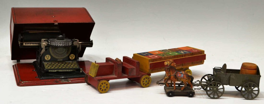 (3) ANTIQUE GROUP CHILDRENS TOYS: (lot of 3) Antique children's toys, comprising: (1) red Junior typewriter, 5.25"h, 9"w, 8"d; (1) metal horse drawn carriage with wood barrel, 3"h, 2.5"w, 9.5"l; (1) red wood tractor pulling a trailer 