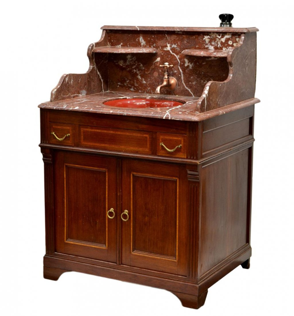 FRENCH MARBLE TOP LAVATORY & PORCELAIN SINK: French marble lavatory late 20th c., high rouge marble back with central porcelain sink and inner sink marked L.B. & Co., France, installed copper faucet, a lower mahogany cabinet with two drawers and