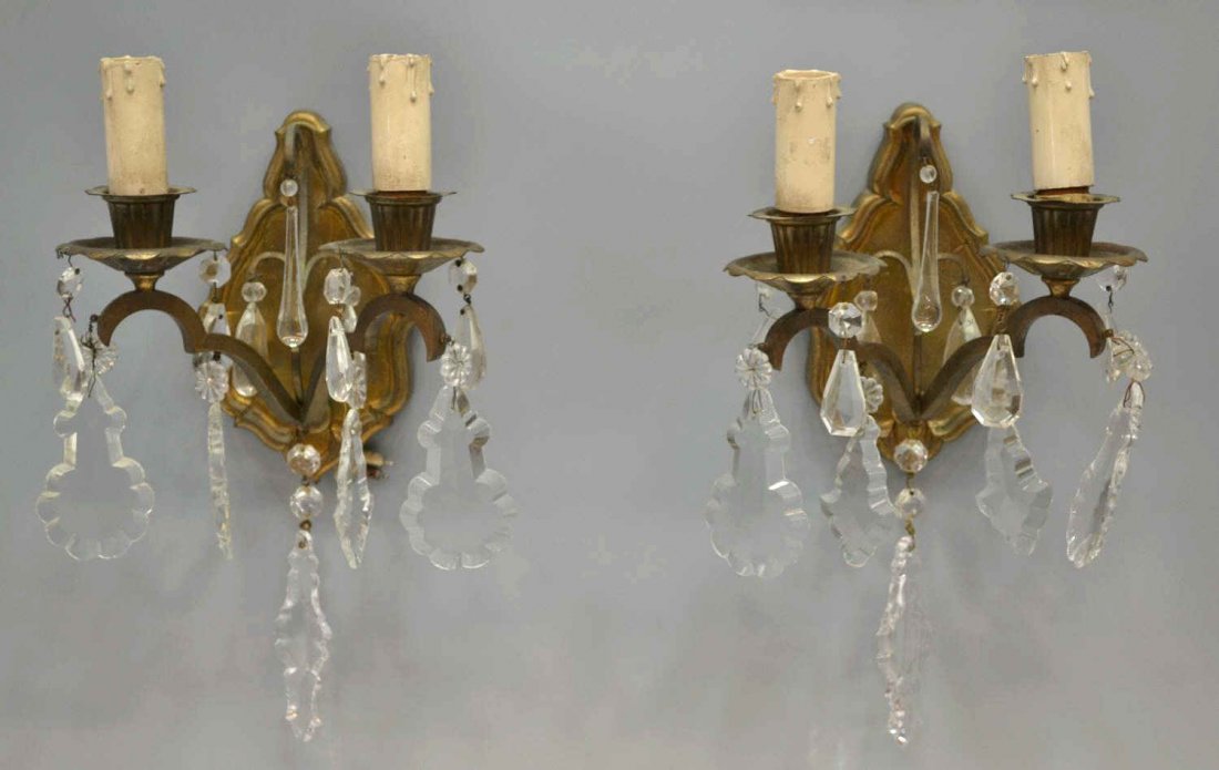 (PAIR)VINTAGE ITALIAN TWO-LIGHT PRISM WALL SCONCES: (pair) Vintage Italian two-light candle sconces hung with varied colorless crystal prisms and swags, early 20th c., need wiring, approx. 13"l, 7.75"w, 5.5lbs total Start Price: $100.00