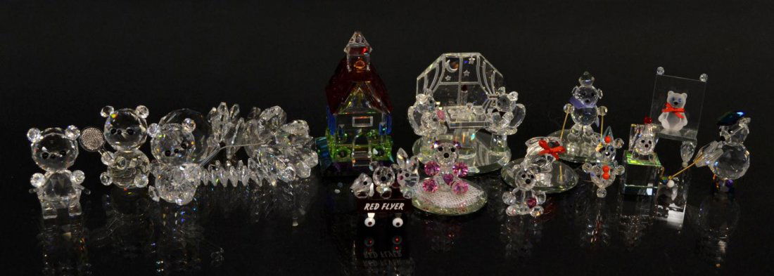(15)CRYSTAL FIGURES, BEARS SKIING, GOLFING, TENNIS: (lot of 15) Collection of crystal figures, including bears doing various activities, a school house, jack-in-the-box, ornament, etc., some possibly Swarovski, largest: 2.75"h, 1lb total Start Price: $