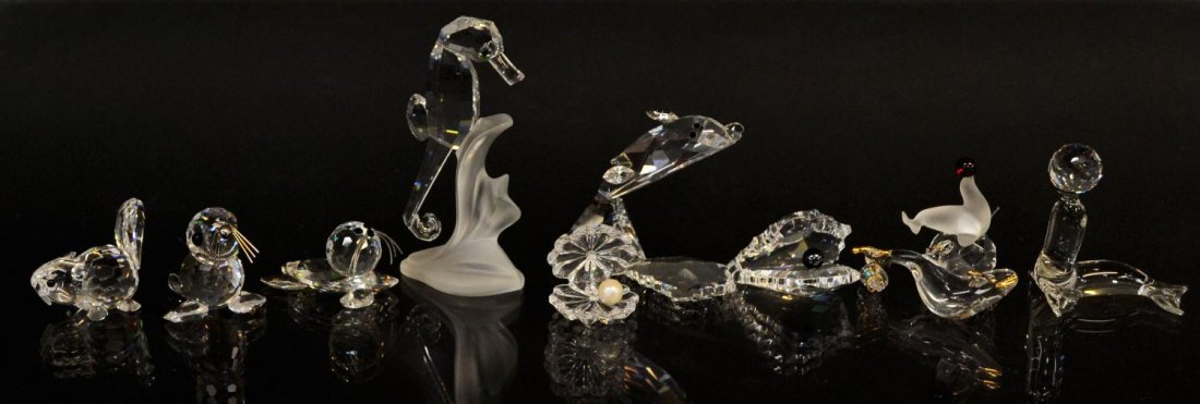 (10) CRYSTAL SEA ANIMALS, SEALS, CLAMS, DOLPHIN: (lot of 10) Collection of crystal figures including, seals, a dolphin, shark, clams, seahorse, beaver, etc. some possibly Swarovski, largest: approx. 3"h, 0.75lbs total Start Price: $50.00