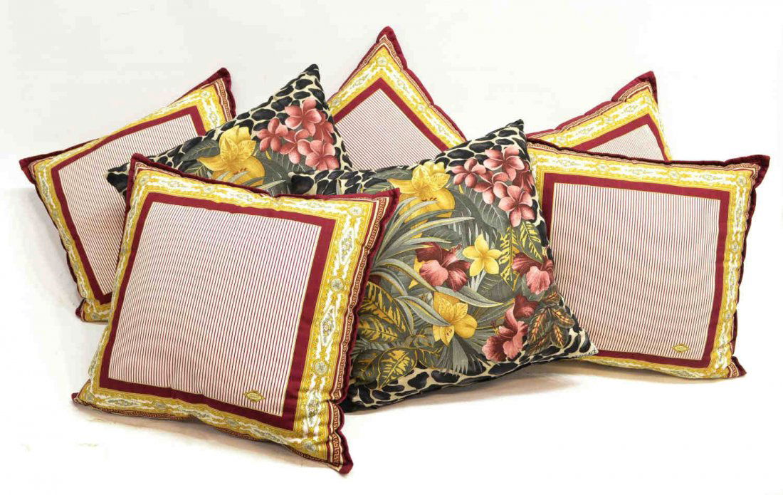 (7) COLLECTION OF VERSACE PILLOWS: (lot of 7) Versace pillows, comprising: (5) Versace Atelier, having a red and white striped with scrolled and foliate border, approx. 16"h, 16"w; (2) with a tropical floral and animal print, 15"h, 15"