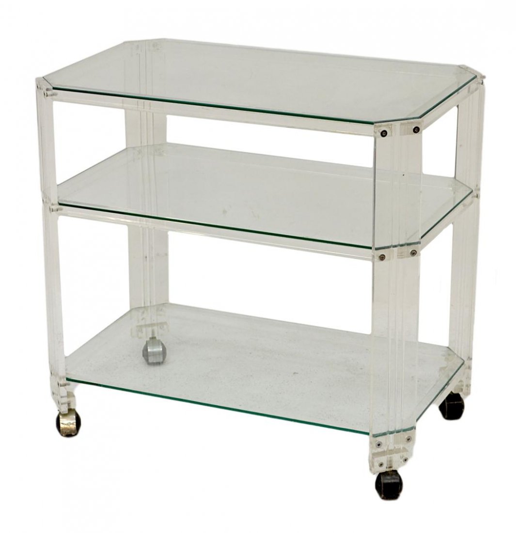 ITALIAN MID-CENTURY MODERN LUCITE FRAMED TEA CART: Italian mid-century modern Lucite frame tea or service cart, three tiers with glass shelves, rising on castors, 25.5"h, 28"w, 17.5"d Start Price: $150.00