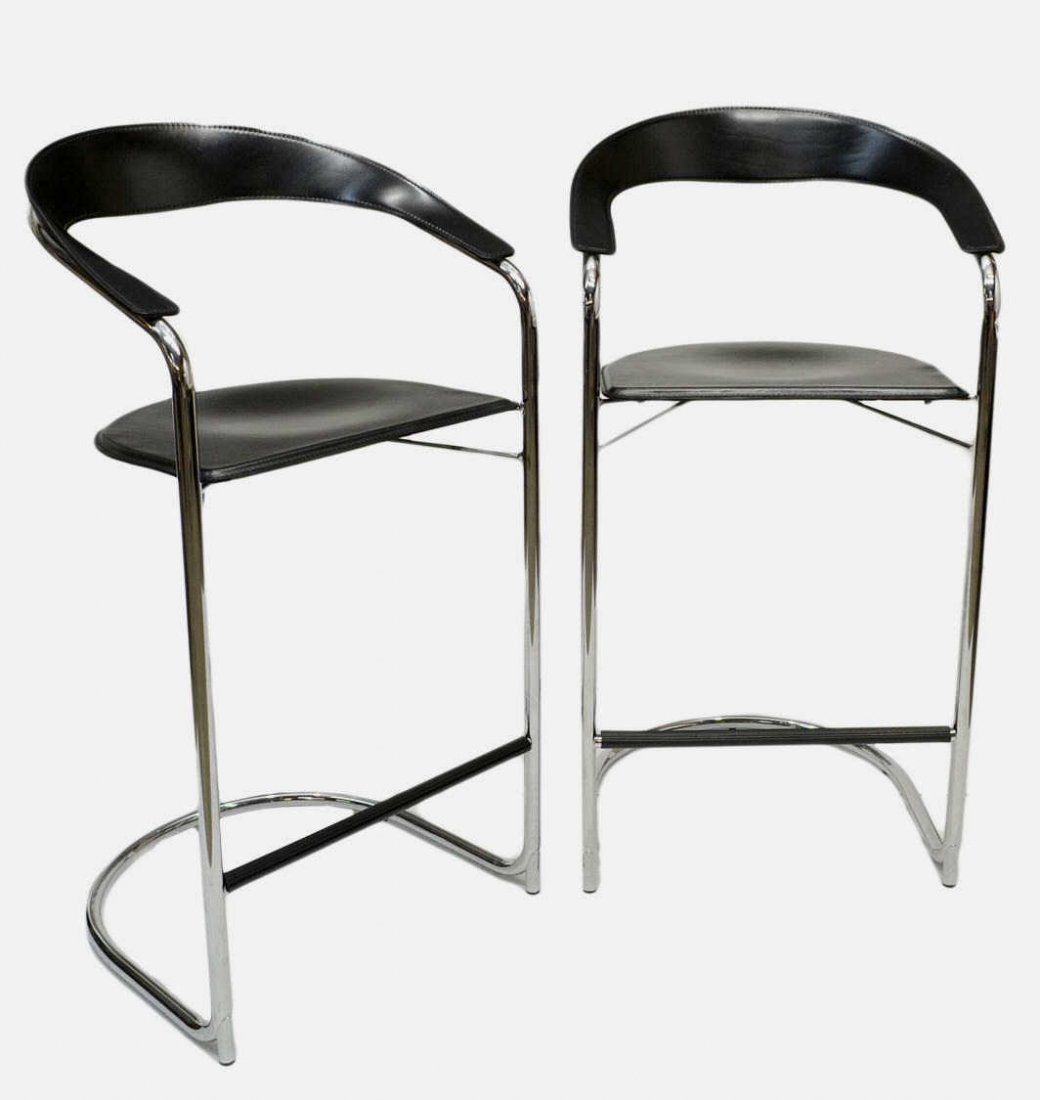 MODERN ITALIAN CANTONI CHROME & LEATHER BARSTOOLS: (pair) Modern Italian design barstools, heavy curved leather backrest and contiguous arm above the conforming seat, chrome frames with black foot bar, purchased from Cantoni, approx overall 42.5"h, 21