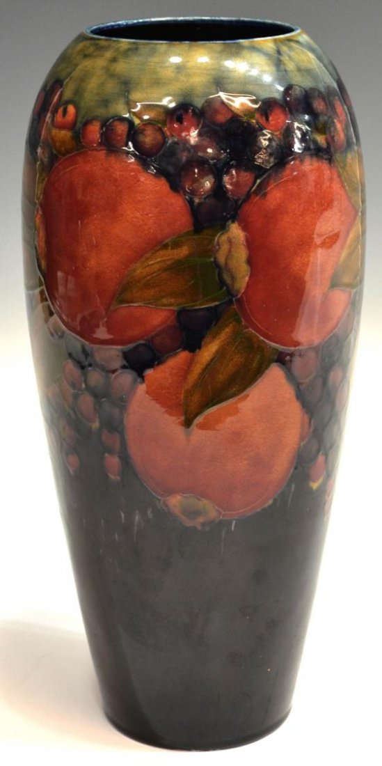 LARGE WILLIAM MOORCROFT POTTERY POMEGRANATE VASE: A large William Moorcroft pottery 'Pomegranate' vase, c. 1916-1918, of tapered form, green painted signature, impressed 'Moorcroft, Burslem England' underfoot, crazing, 14.5"h, 6.75lbs Start Price: $4