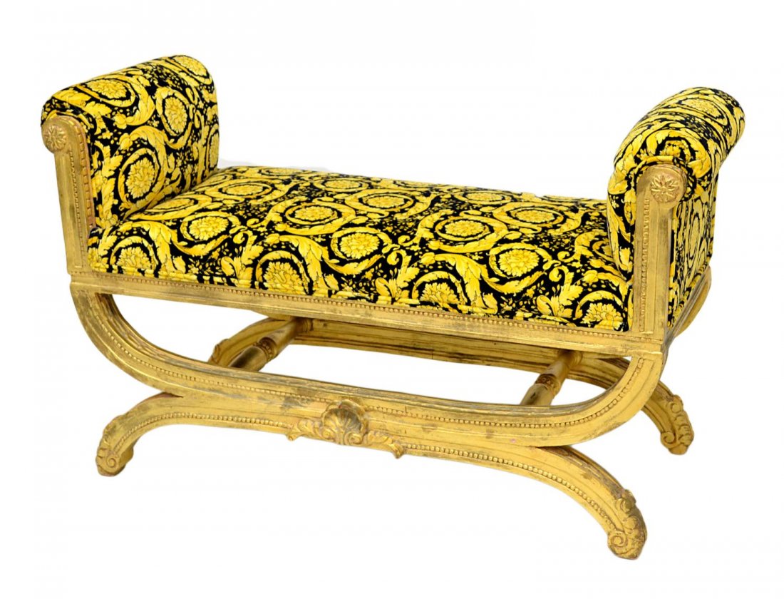 VERSACE VANITY BENCH: Versace vanity bench, purchased from the Versace store, Houston, Versace Home Heritage Collection, a gilt frame with Medusa foliate black and gold upholstery, 26.25"h, 38.25"w, 18"d Start Price: $1000