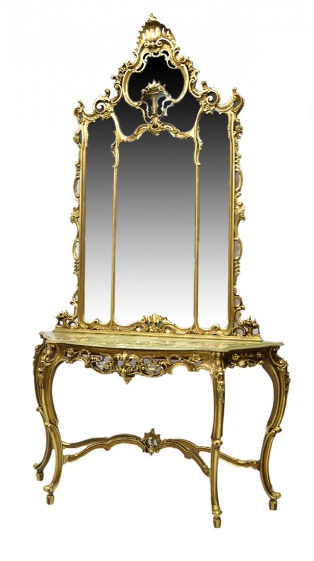 ITALIAN GILTWOOD CONSOLE TABLE & MIRROR, 112.5"H: Italian giltwood console table and mirror in the style of Louis XV, early 20th c., Rococo carved elements throughout, the substantial multi mirror frame surmounting the base with molded onyx top, 112.
