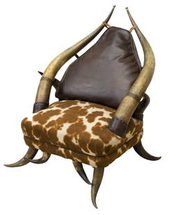 WESTERN HORN FRAME LEATHER & FAUX COWHIDE CHAIR: Western horn frame chair, in the manner of Wenzel Friedrich (1827-1902), large horns as stiles with pierced copper decorative band, leather cushion back, over faux cowhide covered seat, rising on horn