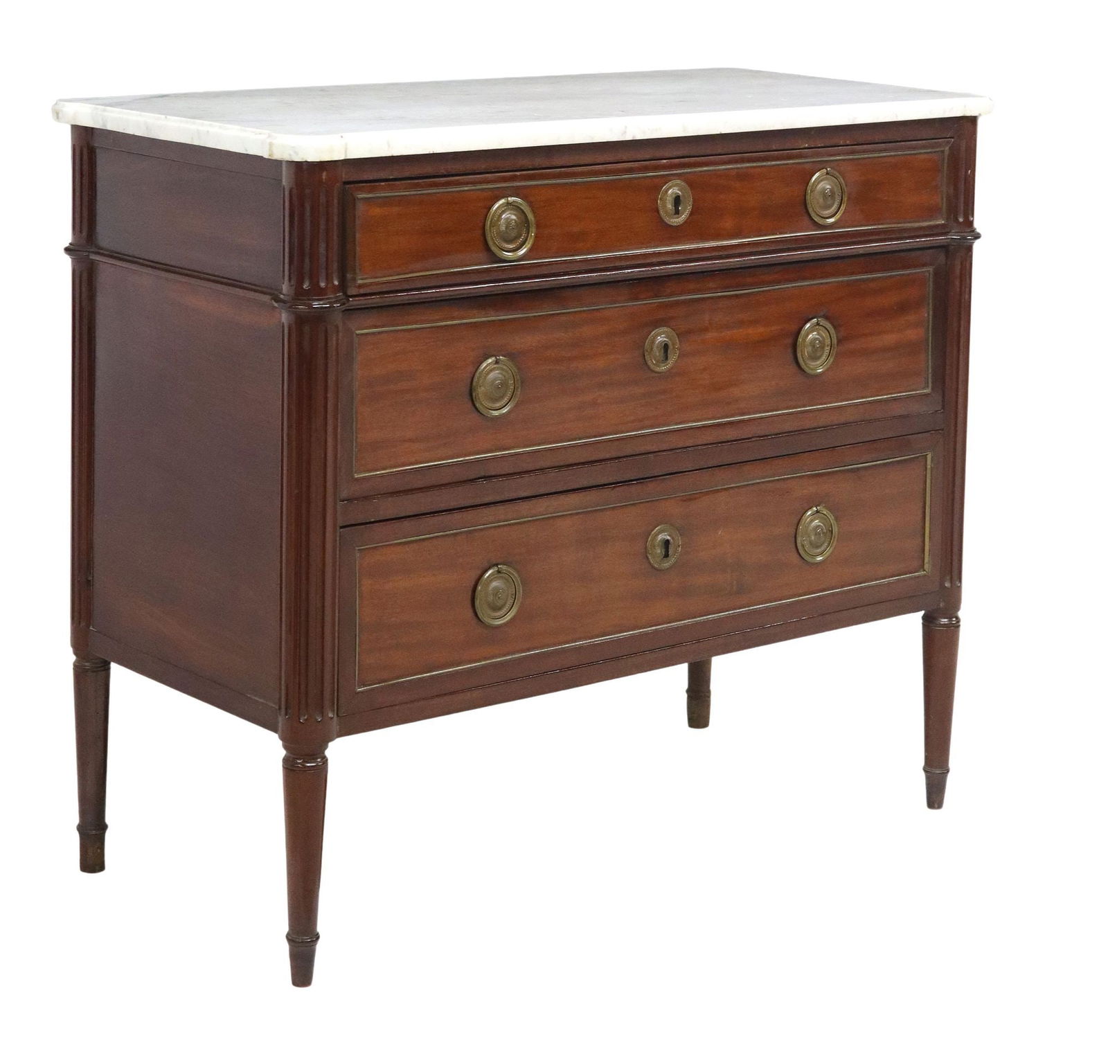 FRENCH LOUIS XVI STYLE MARBLE-TOP MAHOGANY COMMODE: French Louis XVI style mahogany commode, early 20th c., shaped marble top, three drawers with gilt metal trim, fluted corner posts, on tapered legs, approx 34"h, 39.5"w, 18.75"d