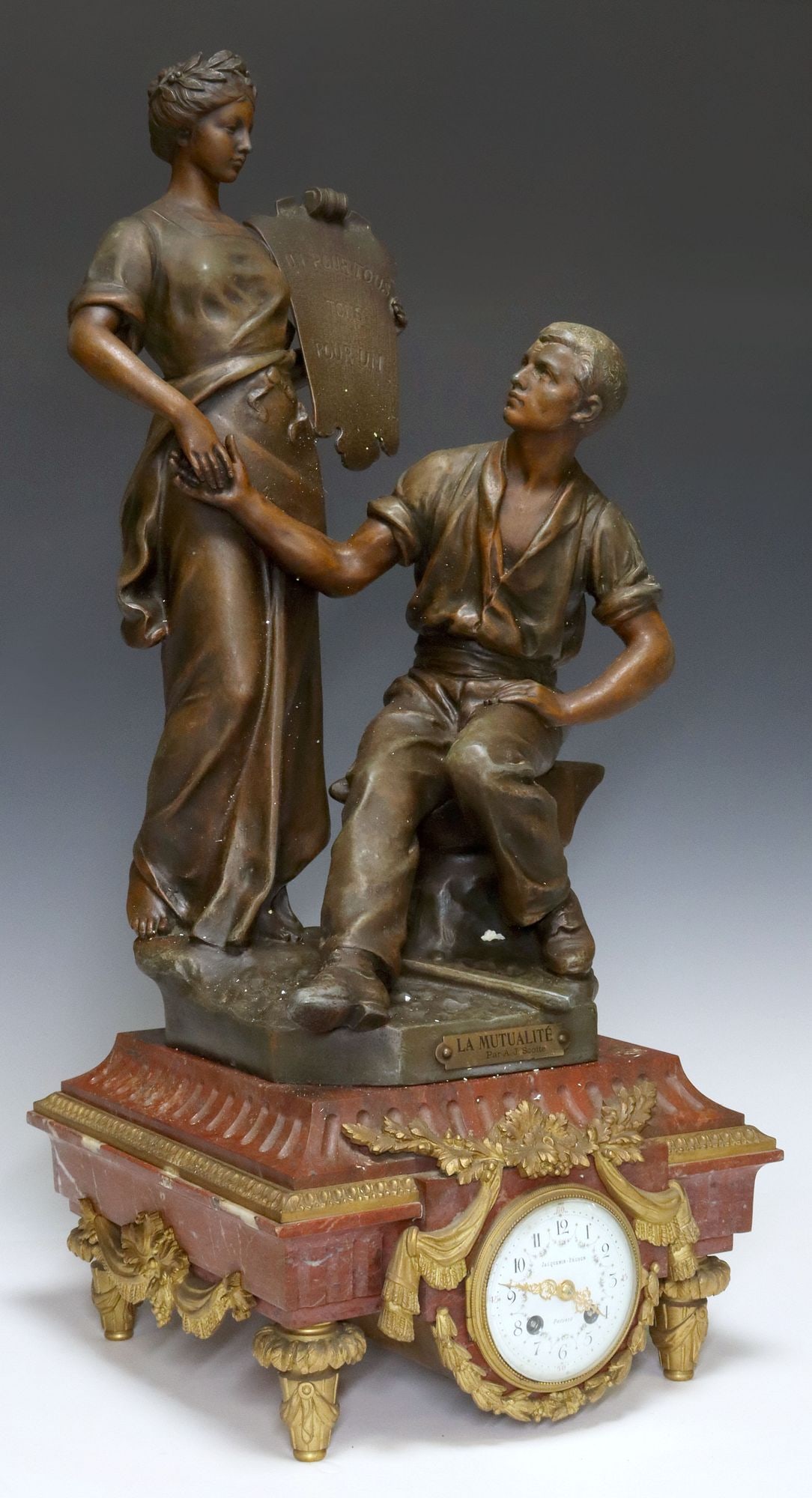 FRENCH ROUGE MARBLE FIGURAL MANTEL CLOCK: French figural mantel clock, late 19th c., patinated metal sculpture, "La Mutualite," after A.J. Scotte (French, 1867-1925), enamel fancy dial, inscribed Jacquemin-Pechon, Poitiers, tim