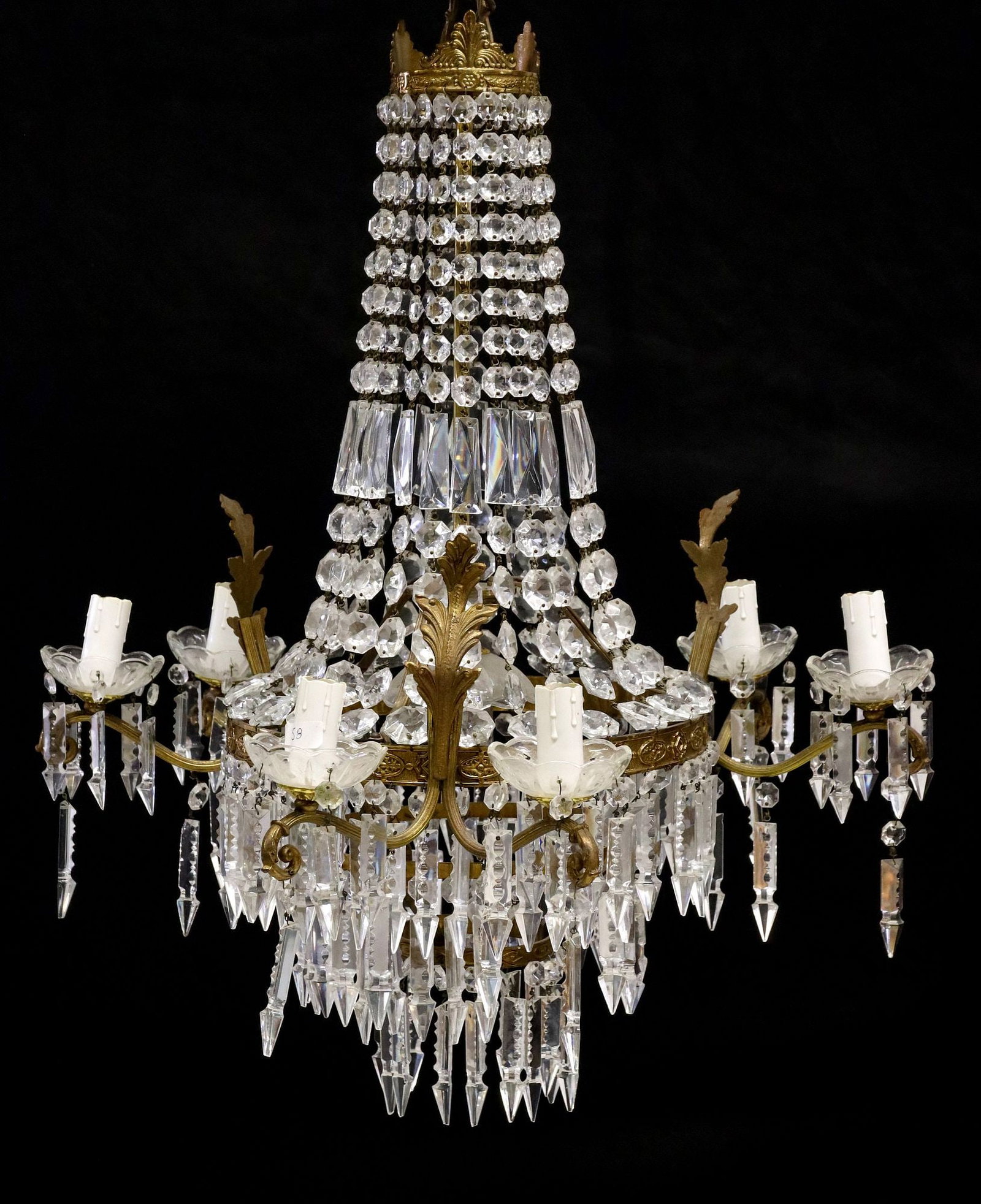 FRENCH EMPIRE STYLE SAC-A-PEARL 7-LT CRYSTAL CHANDELIER: French Empire style seven-light sac-a-pearl chandelier, 20th c., having palmette crest, over circular frame hung with faceted crystal beads and prisms, issuing six scrolled arms, each terminating on s