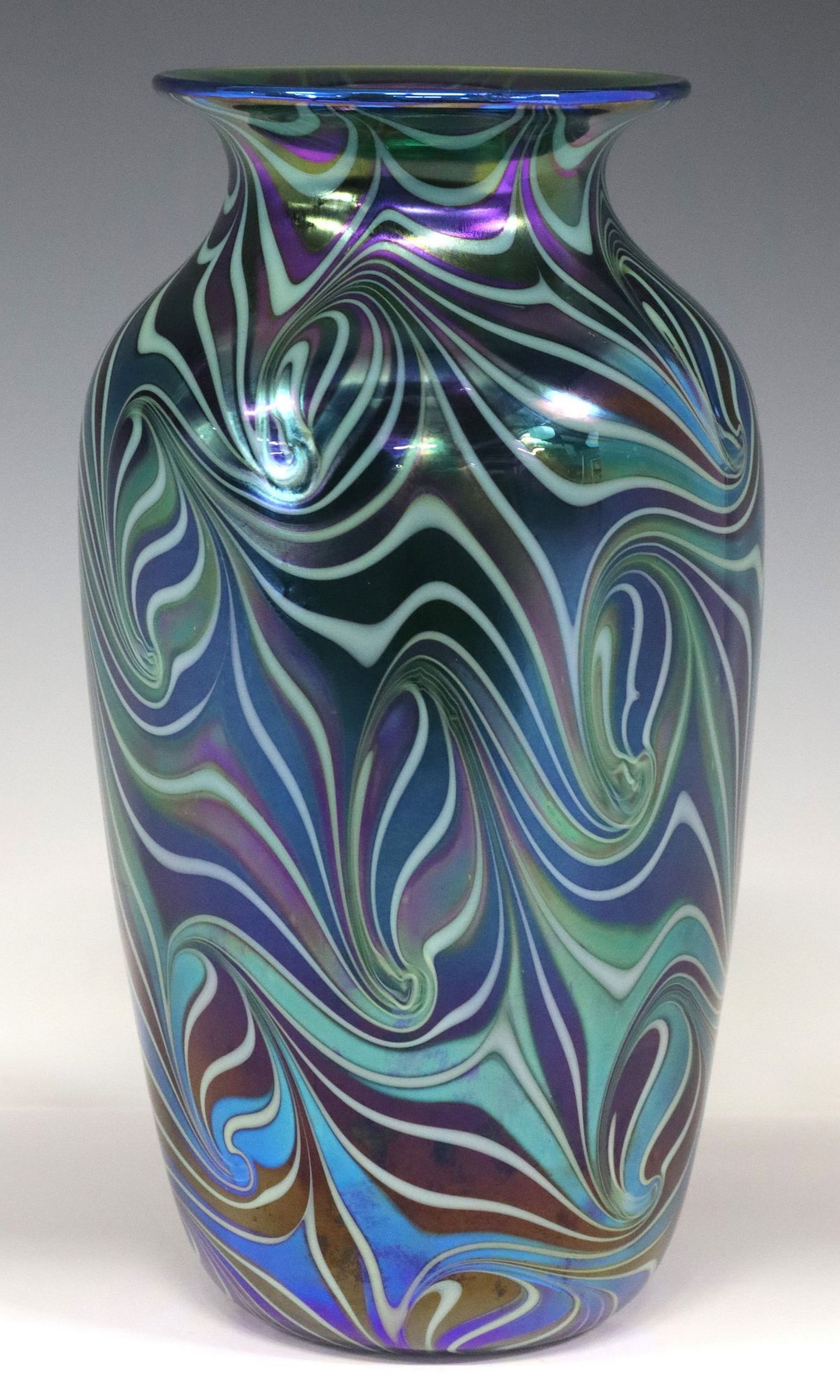ORIENT & FLUME STUDIO ART GLASS IRIDESCENT BLUE SWIRL PATTERN VASE: Studio art glass iridescent vase, Orient and Flume, having flared rim over tapered body, with intricate blue and mint green swirl pattern, registration number 0251U90F07190B, approx 10"h, 5.