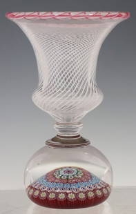 FRENCH SAINT LOUIS ART GLASS MILLEFIORI PAPERWEIGHT PEN HOLDER: French studio art glass millefiori paperweight pen holder, Saint-Louis, cane date 1973, having flared rim with filigree twist border, above shaped cup with latticino spiral, rising on paperweight-form