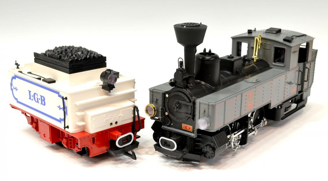 (2) LGB LOCOMOTIVE #2070D & TENDER #2317/6: (lot of 2) LGB model train steam locomotive #2070 D, styrofoam box and original outer box, together with coal tender #2317/6 in original box, largest box: 5.5"h, 18.5"l, 8.5"w, total: 9.75lbs Start Pr