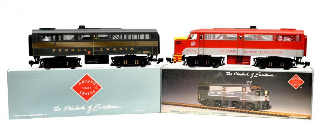 (2) ARISTO MODEL TRAIN DIESEL LOCOMOTIVES, BOXES: (lot of 2) Aristo Craft model train locomotives in original boxes: (1) ART-22017, M-K-T / Katy, Diesel Alco FA-1; (1) ART-22063, Penn. 5-Stripe Bruns. Green, Diesel Alco FB-1; largest box: 7.5"h, 6"w,