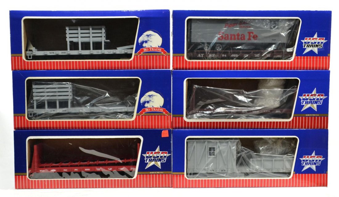 (6) USA & RO VARIOUS MODEL TRAIN CARS, BOXED: (lot of 6) USA Trains & Charles Ro Manufacturing, various cars in original boxes: (1) R-1751, Santa Fe Piggy Back trailer on flat car; (1) 1810, M&W, flat car with stand; (1) C&S flat car; (1) R-1740,